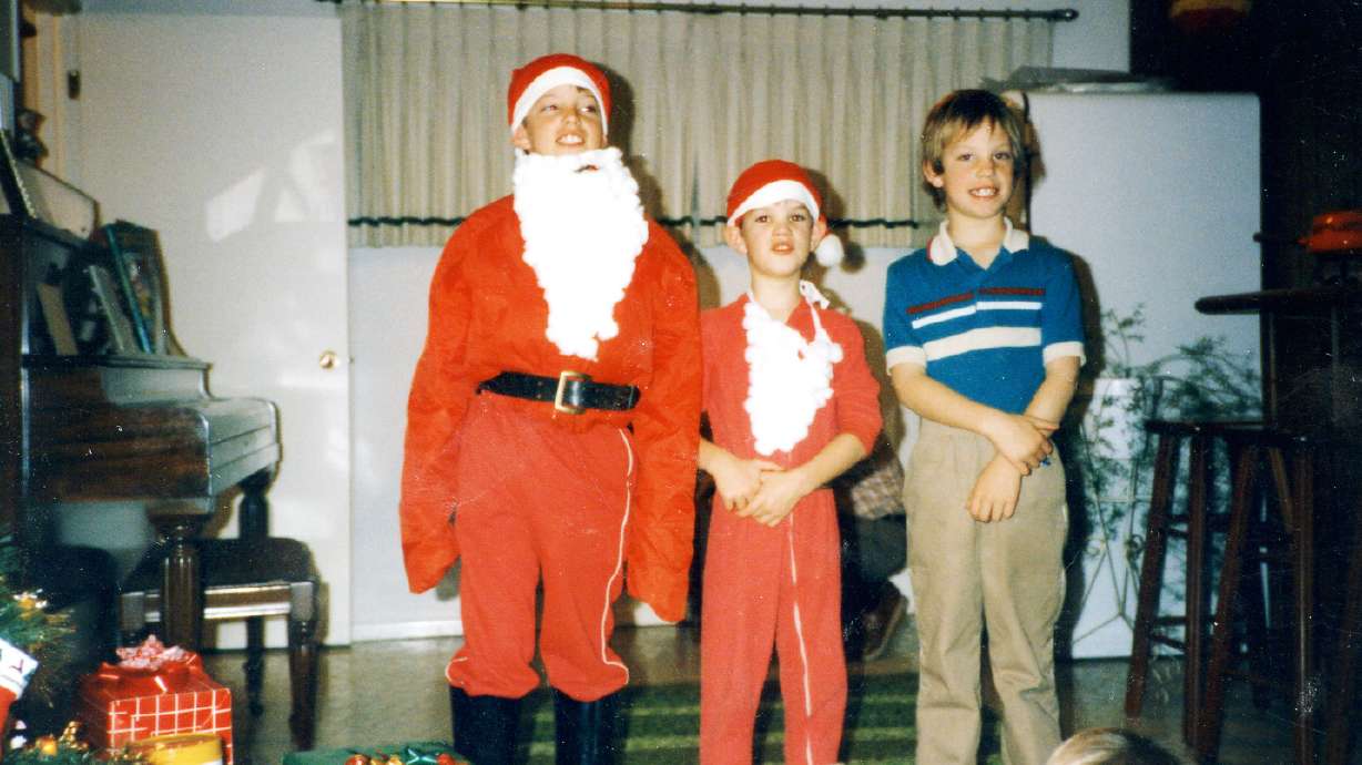 Spencer Evans, of Spanish Fork, with older brother Kurt Evans (left) in this family photo. Evans says he always dreamed of becoming Santa and, at the age of 44, he is finally realizing that dream — real white beard and all.