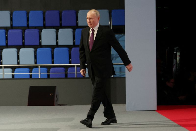 Russian President Vladimir Putin arrives to deliver a speech during the 4th Railway Congress at the Luzhniki Olympic Complex in Moscow, Friday.
