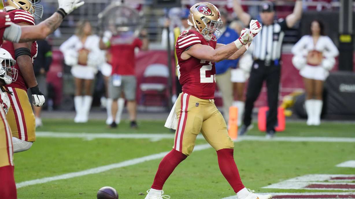 San Francisco 49ers running back Christian McCaffrey celebrates after scoring against the Arizona Cardinals during the second half of an NFL football game Sunday, Dec. 17, 2023, in Glendale, Ariz.