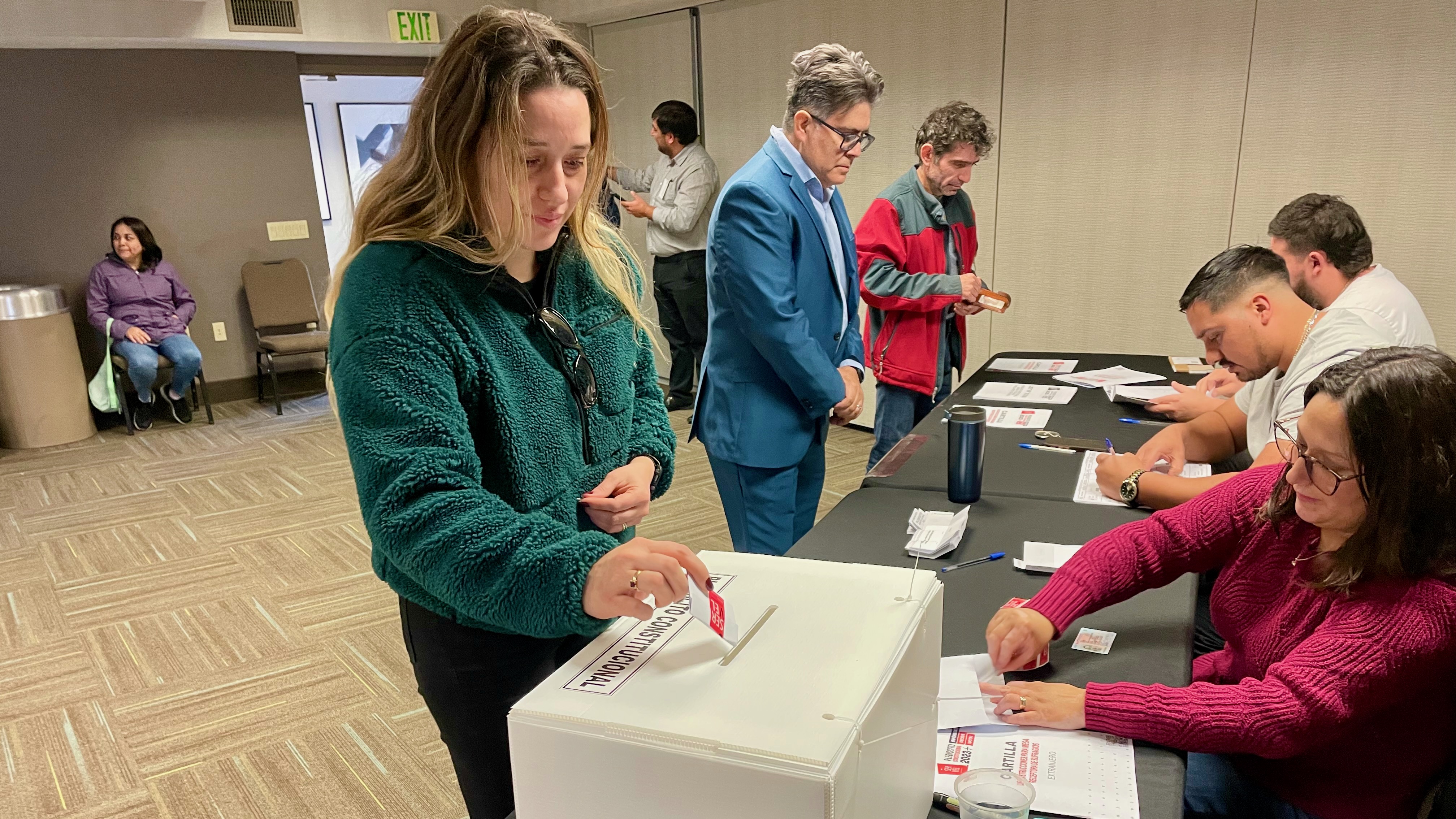 Karoll Adonis casts a ballot Sunday on a proposed new Chilean constitution at a polling place for expatriate Chileans in Sandy. Adonis, originally from Santiago, Chile, lives in Provo. Expatriate Chileans voted at remote polling places all around the world.