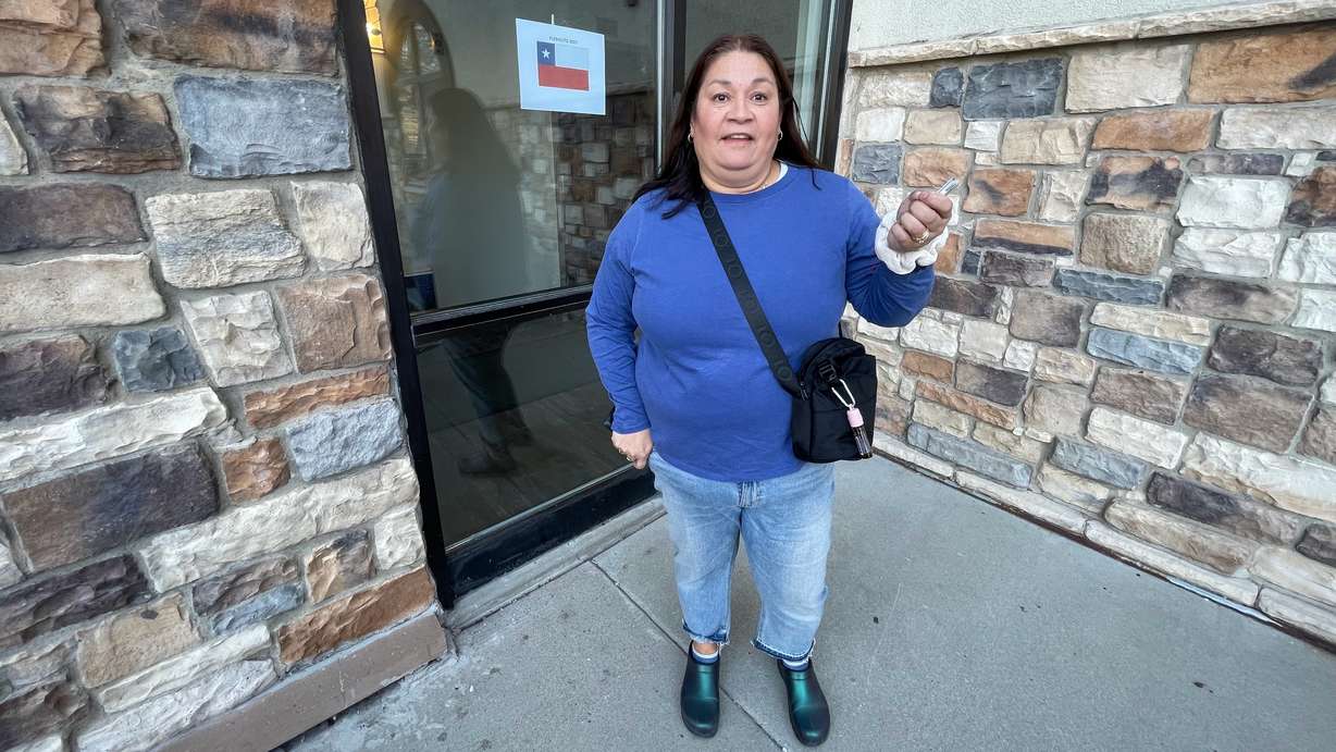 Patricia North, originally from Santiago, Chile, but now living in Vineyard, discusses the vote on the proposed new Chilean constitution after casting a ballot at a remote voting site in Sandy for expatriates. Sandy was one of many sites around the world for expatriates to vote on the proposal Sunday.