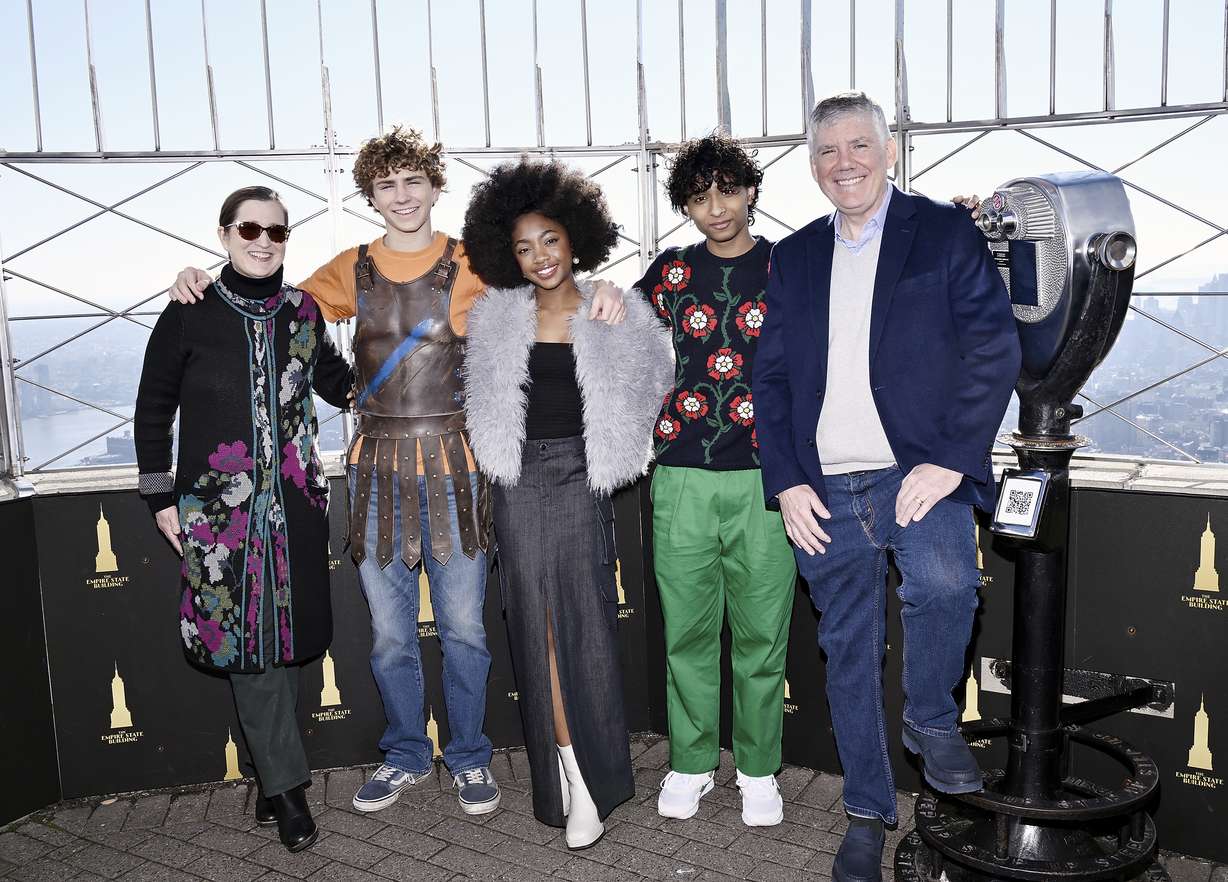 Producer Becky Riordan, Walker Scobell, Leah Sava Jeffries, Aryan Simhadri and co-creator Rick Riordan from "Percy Jackson and the Olympians" visit the Empire State Building on Dec. 12, in New York.