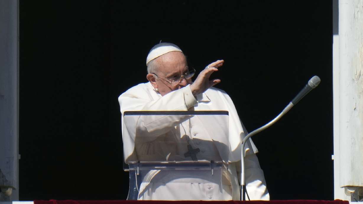 Pope Francis waves during the Angelus noon prayer from the window of his studio overlooking St.Peter's Square, at the Vatican, Sunday. has formally approved allowing priests to bless same-sex couples.