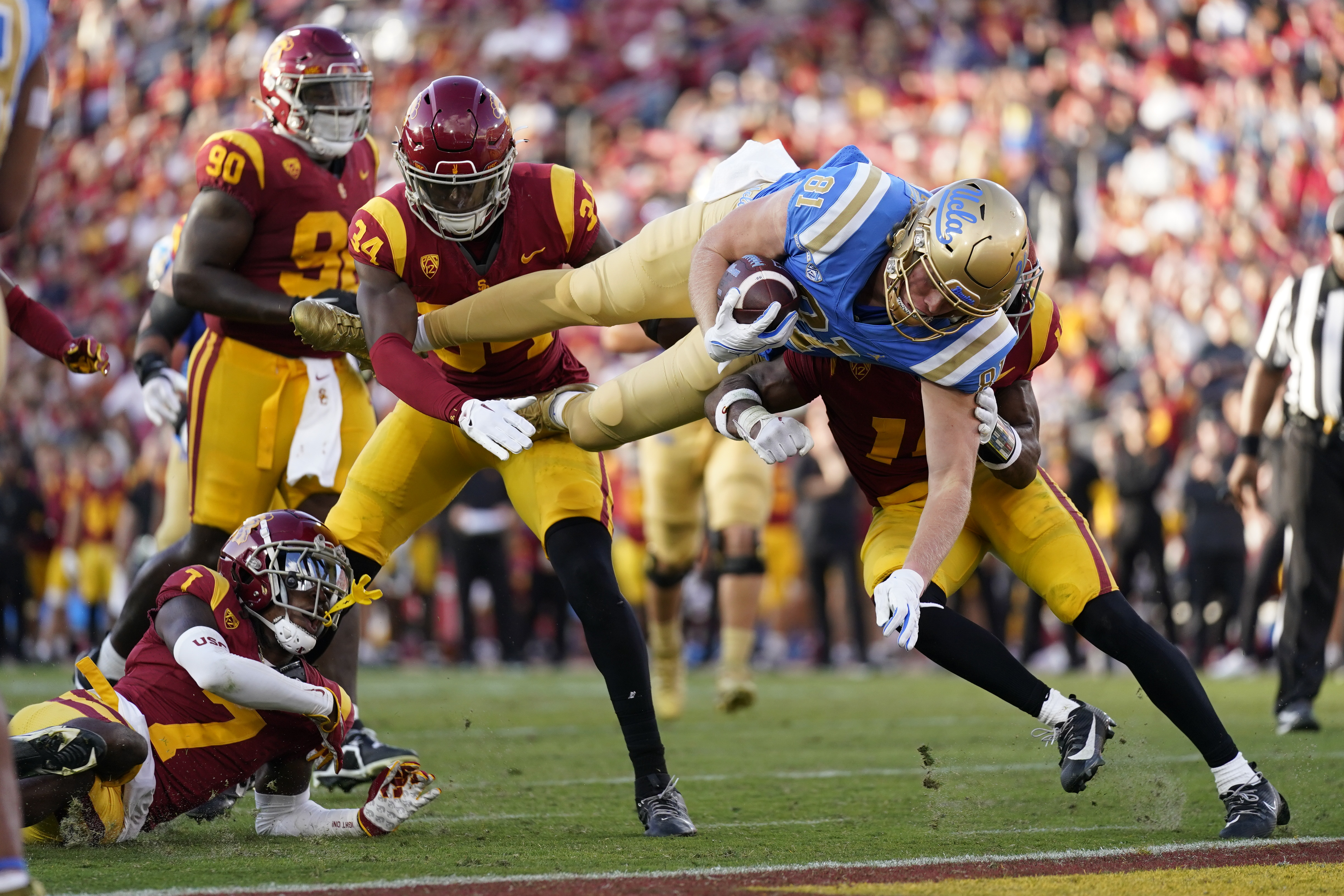 UCLA tight end Hudson Habermehl (81) dives across the goal line for a touchdown during the second half of an NCAA college football game against Southern California in Los Angeles, Saturday, Nov. 18, 2023. 