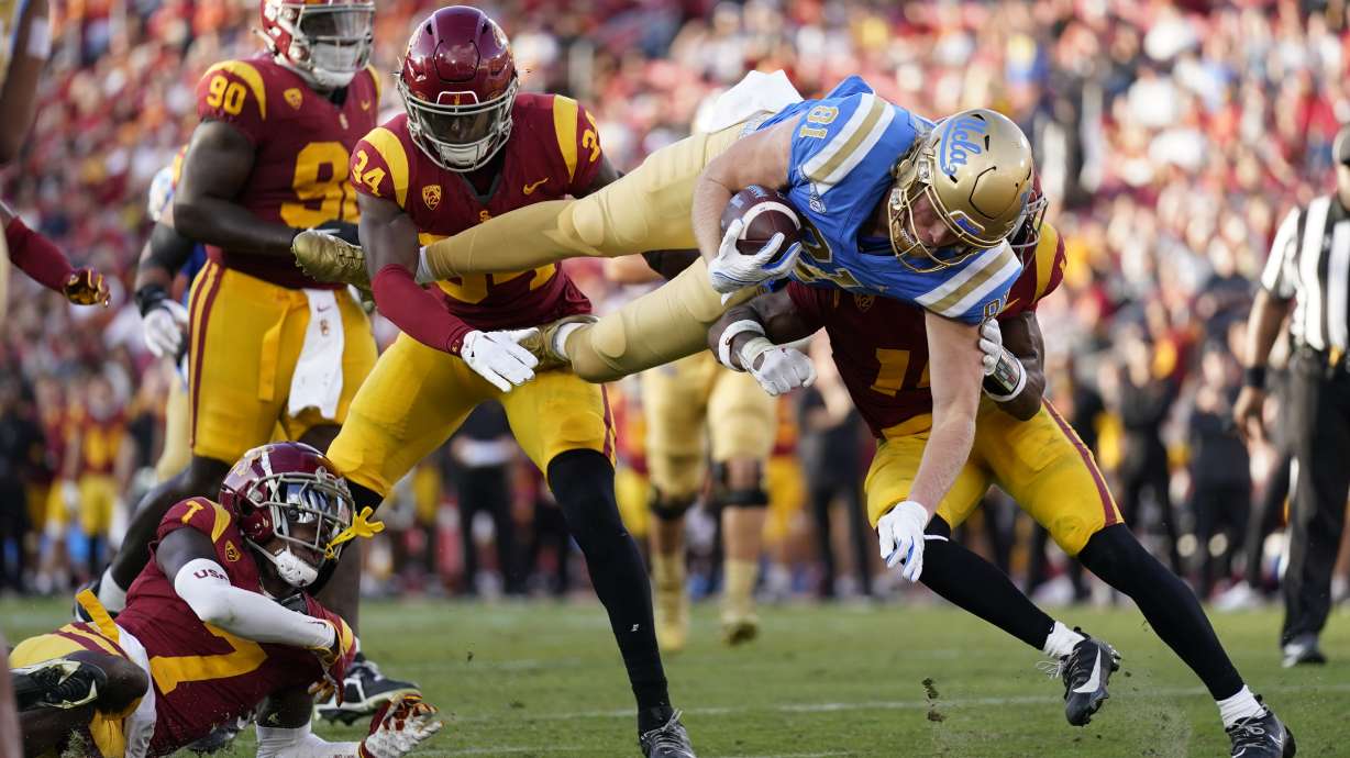 UCLA tight end Hudson Habermehl (81) dives across the goal line for a touchdown during the second half of an NCAA college football game against Southern California in Los Angeles, Saturday, Nov. 18, 2023.