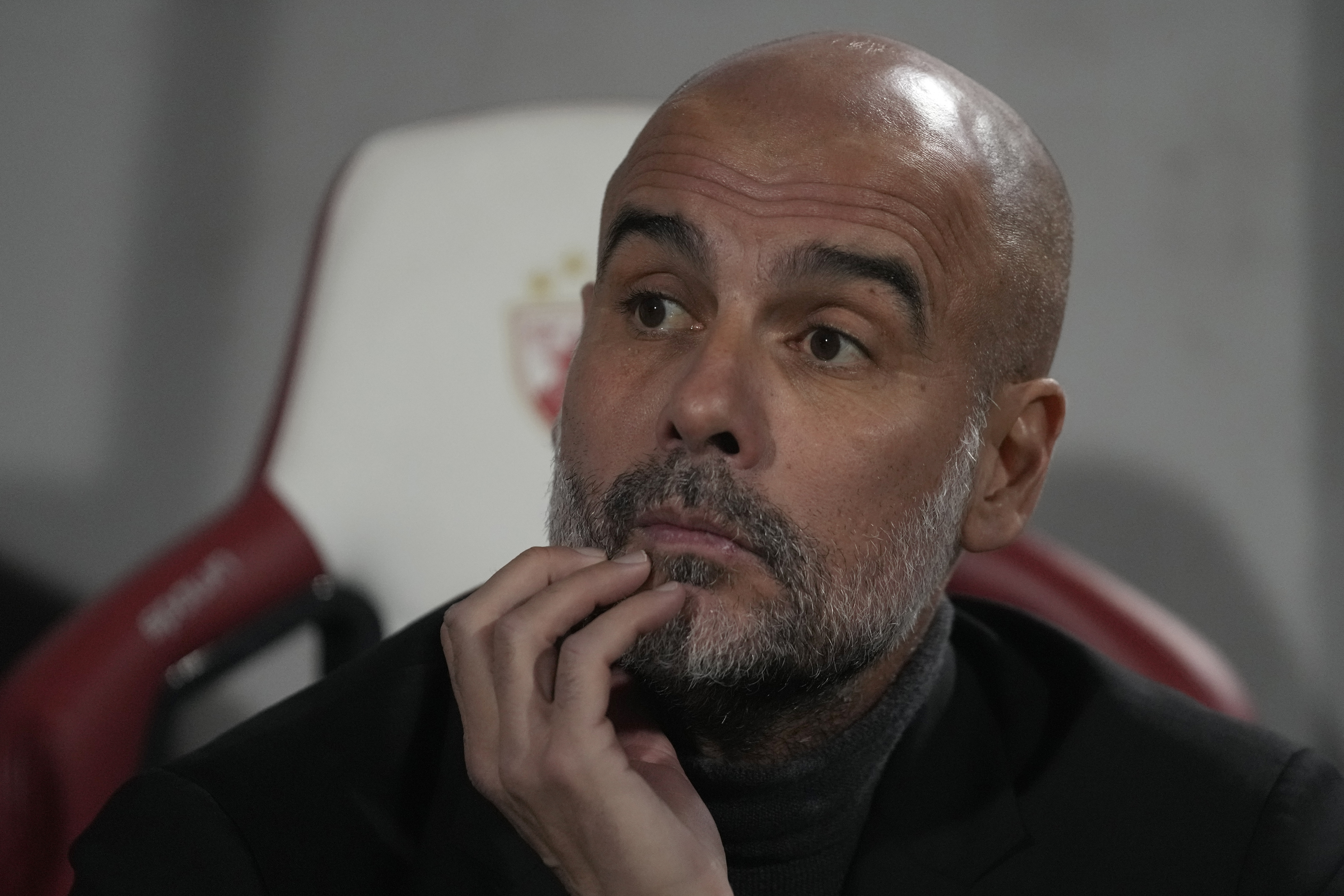 Manchester City's head coach Pep Guardiola waits for the start of the Group G Champions League soccer match between Red Star and Manchester City, at the Rajko Mitic Stadium in Belgrade, Serbia, Wednesday, Dec. 13, 2023. 