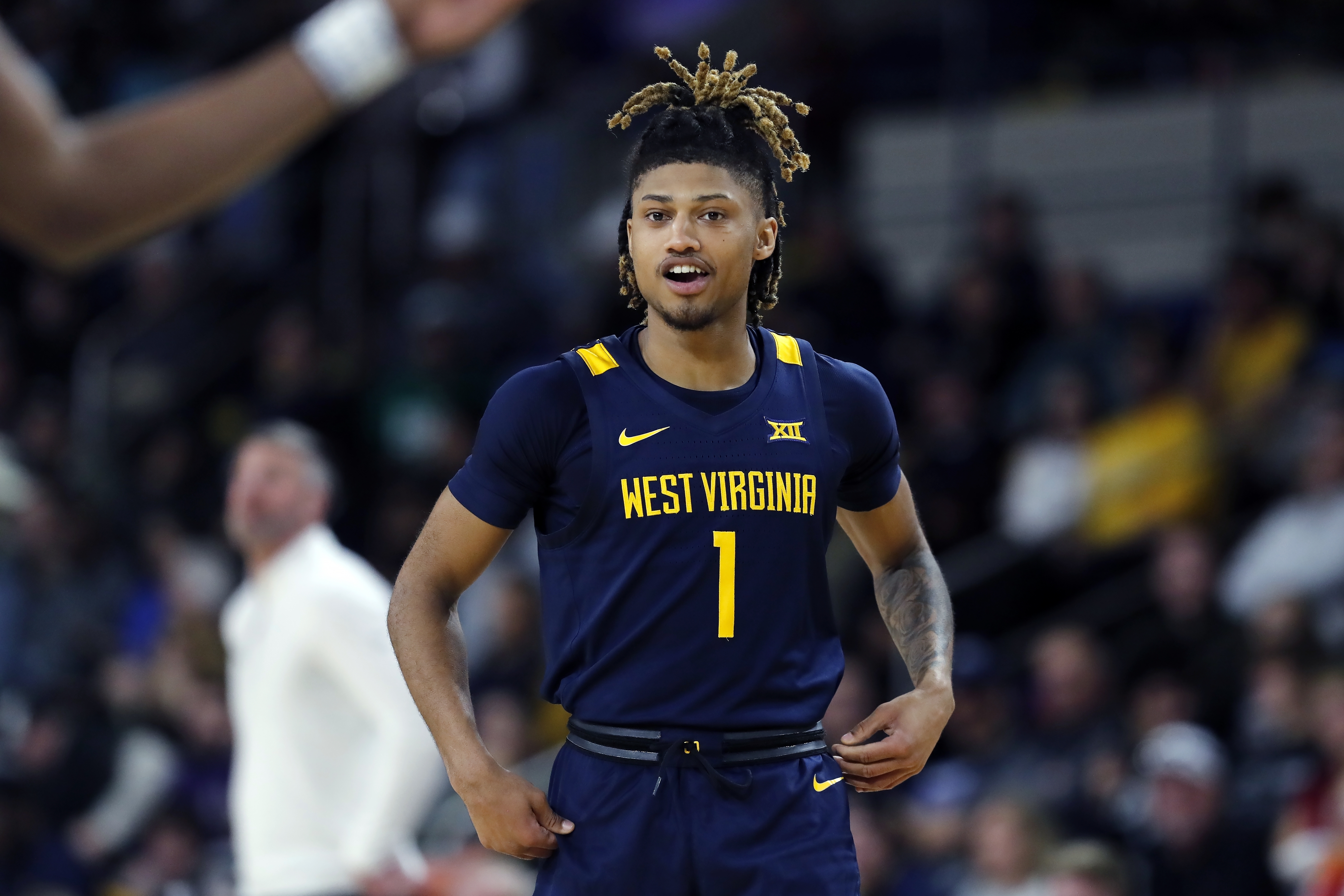 West Virginia's Noah Farrakhan takes the court during the first half of the team's NCAA college basketball game against UMass in the Basketball Hall of Fame Classic, Saturday, Dec. 16, 2023, in Springfield, Mass.