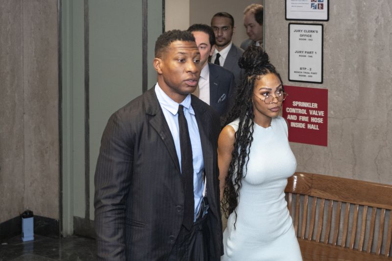 Jonathan Majors, accompanied by girlfriend Meagan Good, enters a courtroom at the Manhattan Criminal Courthouse in New York, Dec. 14