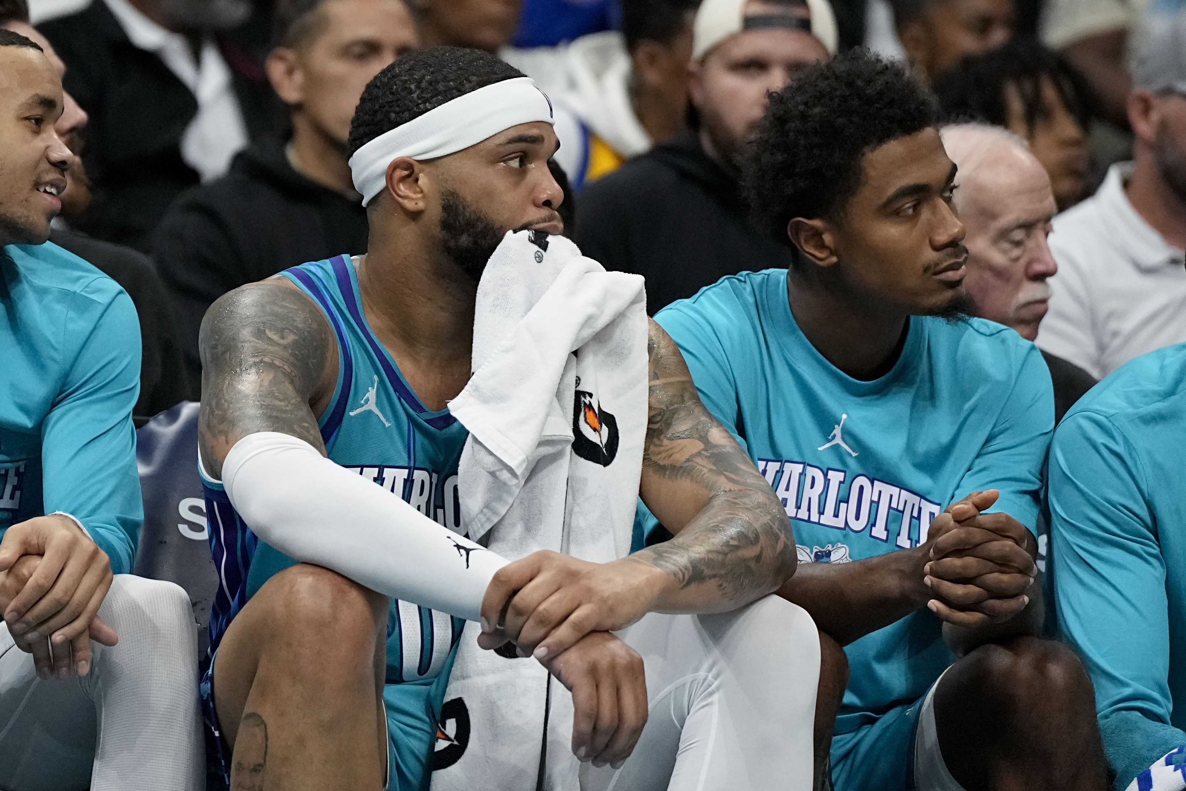 Charlotte Hornets forward Miles Bridges watches from the bench during the second half of an NBA basketball game against the New York Knicks on Saturday, Nov. 18, 2023, in Charlotte, N.C. 