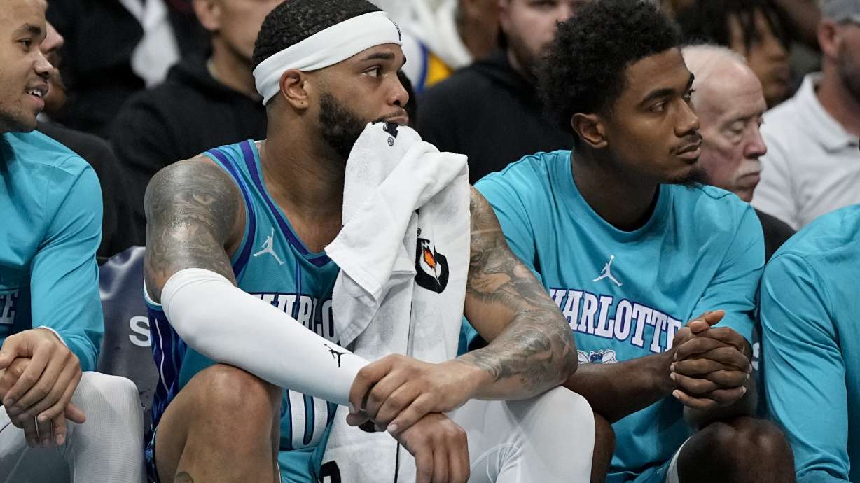 Charlotte Hornets forward Miles Bridges watches from the bench during the second half of an NBA basketball game against the New York Knicks on Saturday, Nov. 18, 2023, in Charlotte, N.C.