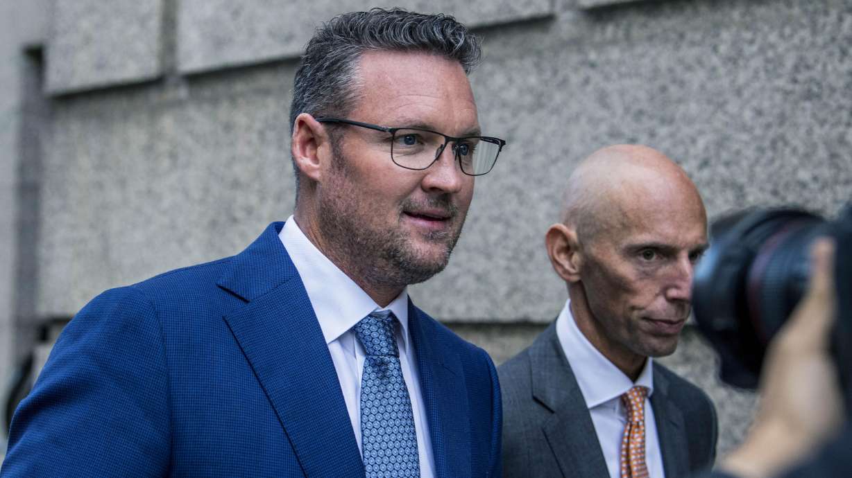 Trevor Milton, left, leaves the Thurgood Marshall United States Courthouse, Sept. 12, 2022, in New York. Milton was sentenced Monday to four years in prison for his conviction for exaggerating claims about his company’s production of zero-emission 18-wheel trucks, causing investors to lose hundreds of thousands of dollars.