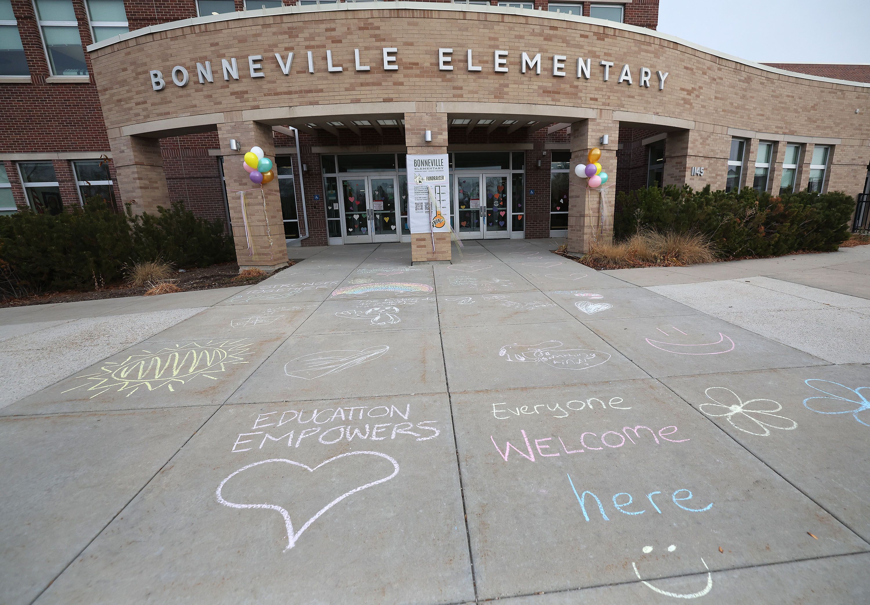 Chalk art was drawn by students and parents at Bonneville Elementary School after hate vandalism occurred at the school in Salt Lake City on Monday.