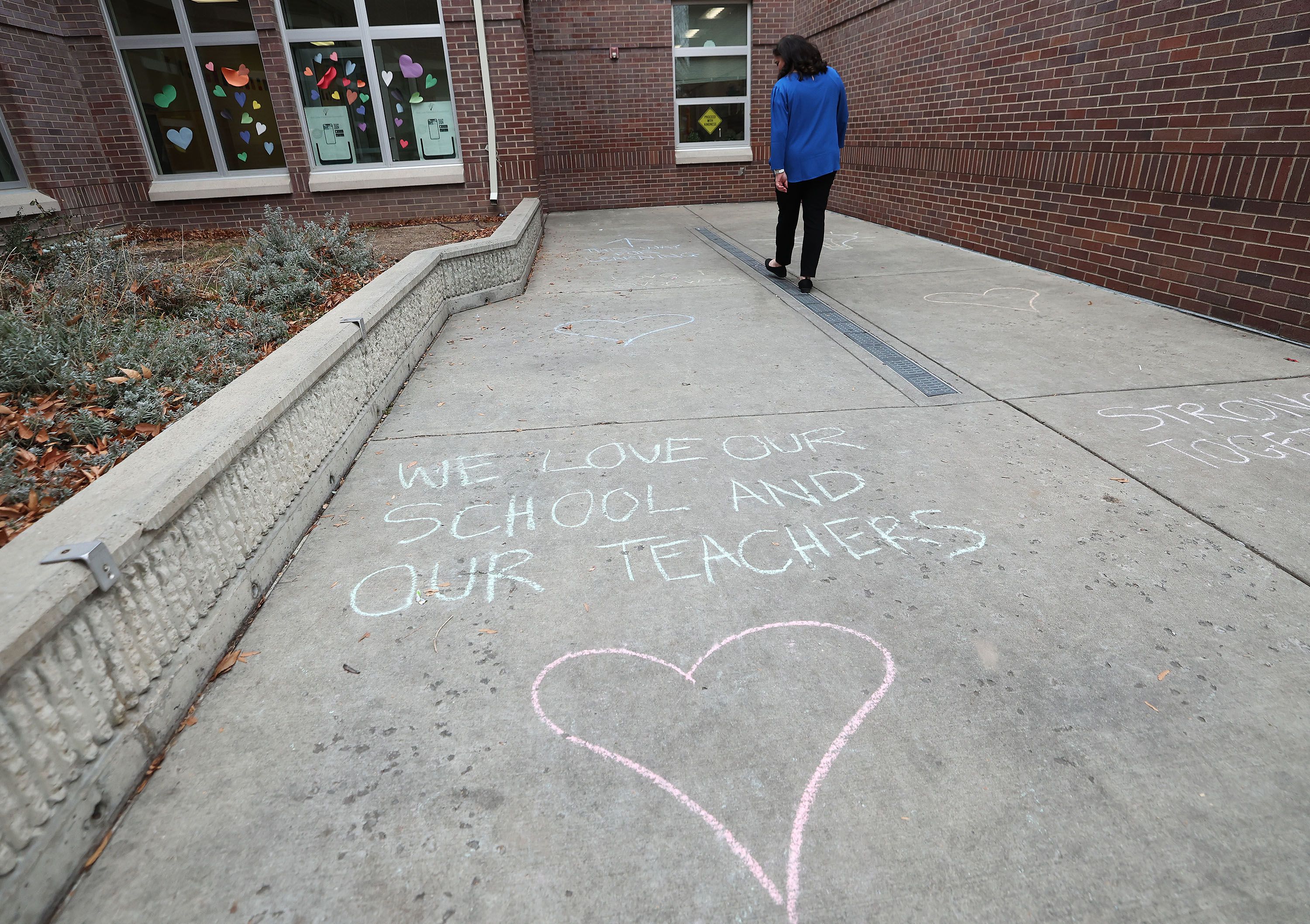 Chalk art was drawn by students and parents at Bonneville Elementary School after hate vandalism occurred at the school in Salt Lake City on Monday.