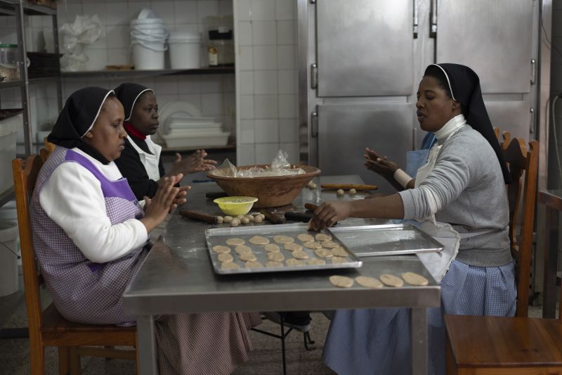 Pestiños, honey-coated pastries, are kneaded before frying by the cloistered nuns of the Clarisas convent in Carmona, Spain, on Nov. 30.