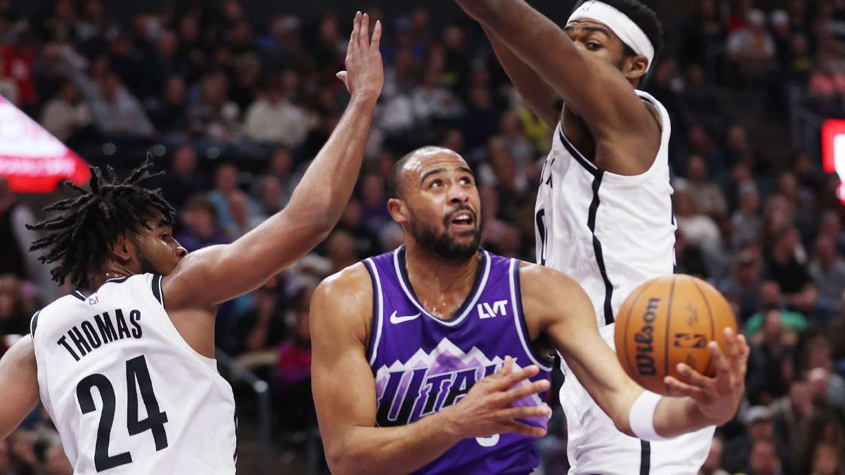 Utah Jazz guard Talen Horton-Tucker (5) drives by Brooklyn Nets guard Cam Thomas (24) in Salt Lake City on Monday, Dec. 18, 2023. The Jazz won 125-108.