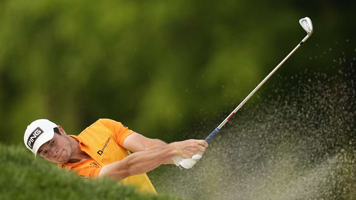 FILE - Viktor Hovland, of Norway, fails to get his ball out of the bunker on the 16th hole during the final round of the PGA Championship golf tournament at Oak Hill Country Club on Sunday, May 21, 2023, in Pittsford, N.Y. The previous day, Corey Conners was in the same bunker and also didn't get it out.