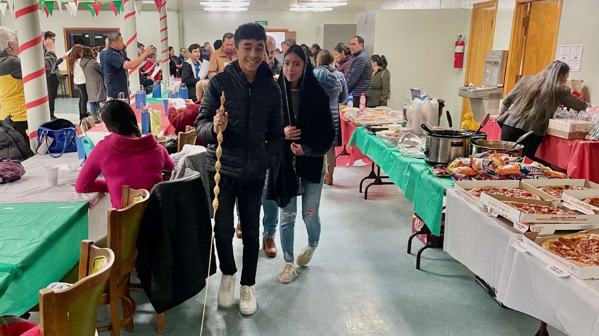 Jesus Contreras and Judith Castaneda represent Joseph and Mary in part of the Las Posadas tradition on Monday. St. Joseph Catholic Church in Ogden is melding Las Posadas and Simbang Gabi Christmas traditions in a series of activities this week.