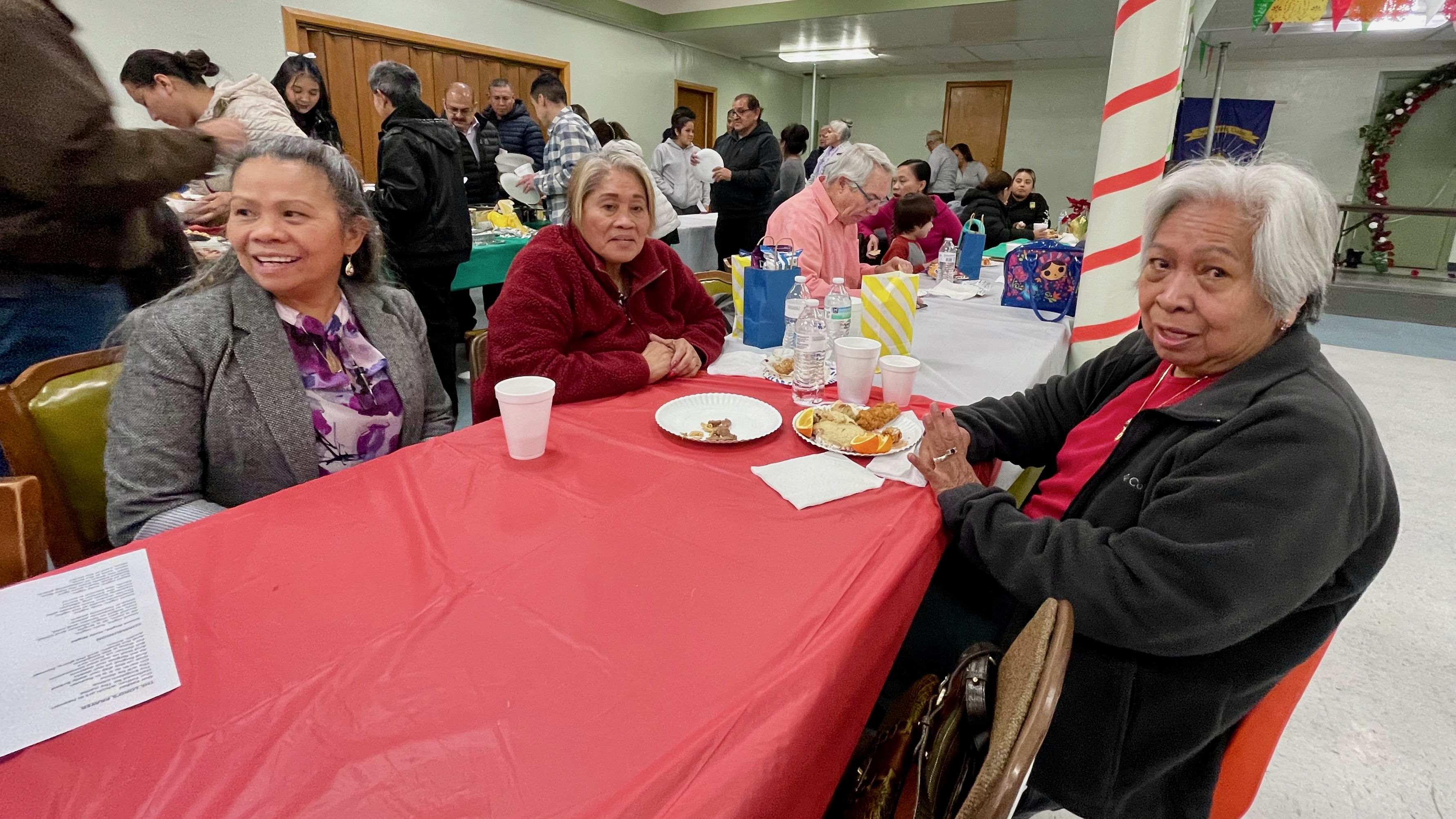 From left, Purita Buck, Elvie Haring and Gloria Hadley on Monday, at the melded Las Posadas and Simbang Gabi activities held at St. Joseph Catholic Church in Ogden. Las Posadas and Simbang Gabi are traditions in Mexico and the Philippines, respectively. The three women are originally from the Philippines but now live in northern Utah.