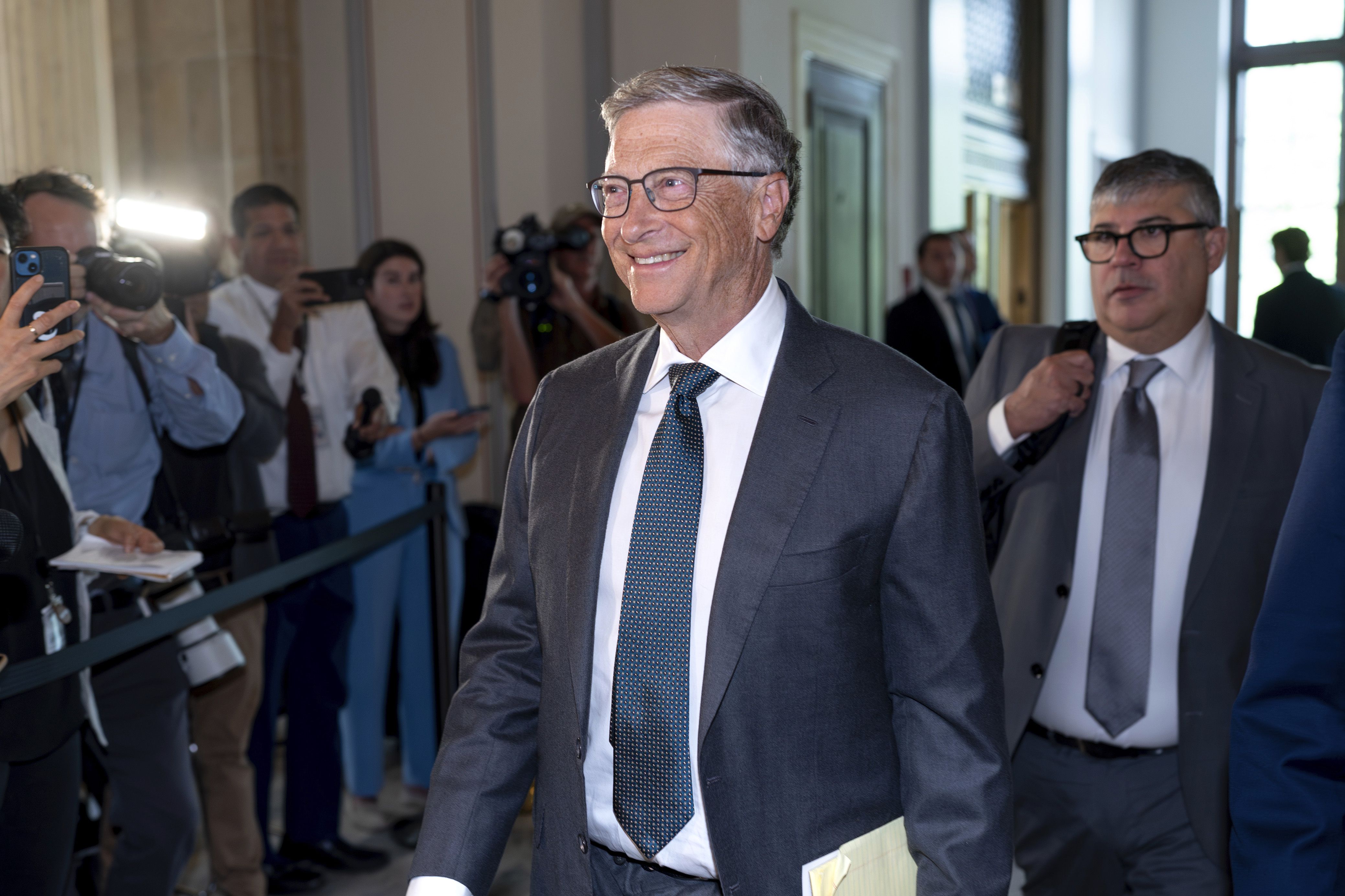 Bill Gates arrives on Capitol Hill for a gathering of tech CEOs to discuss the priorities and risks of artificial intelligence and regulation, in Washington on Sept. 13. Gates focused onoptimistic potentials for AI in his year-end letter released Tuesday.