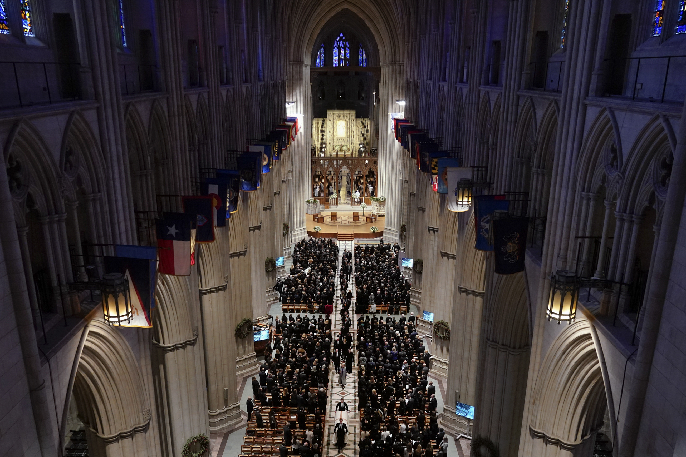 The casket of retired Supreme Court Justice Sandra Day O'Connor is escorted out of the Washington National Cathedral during a funeral service Tuesday, in Washington. O'Connor, an Arizona native and the first woman to serve on the nation's highest court, died on Dec. 1 at age 93.