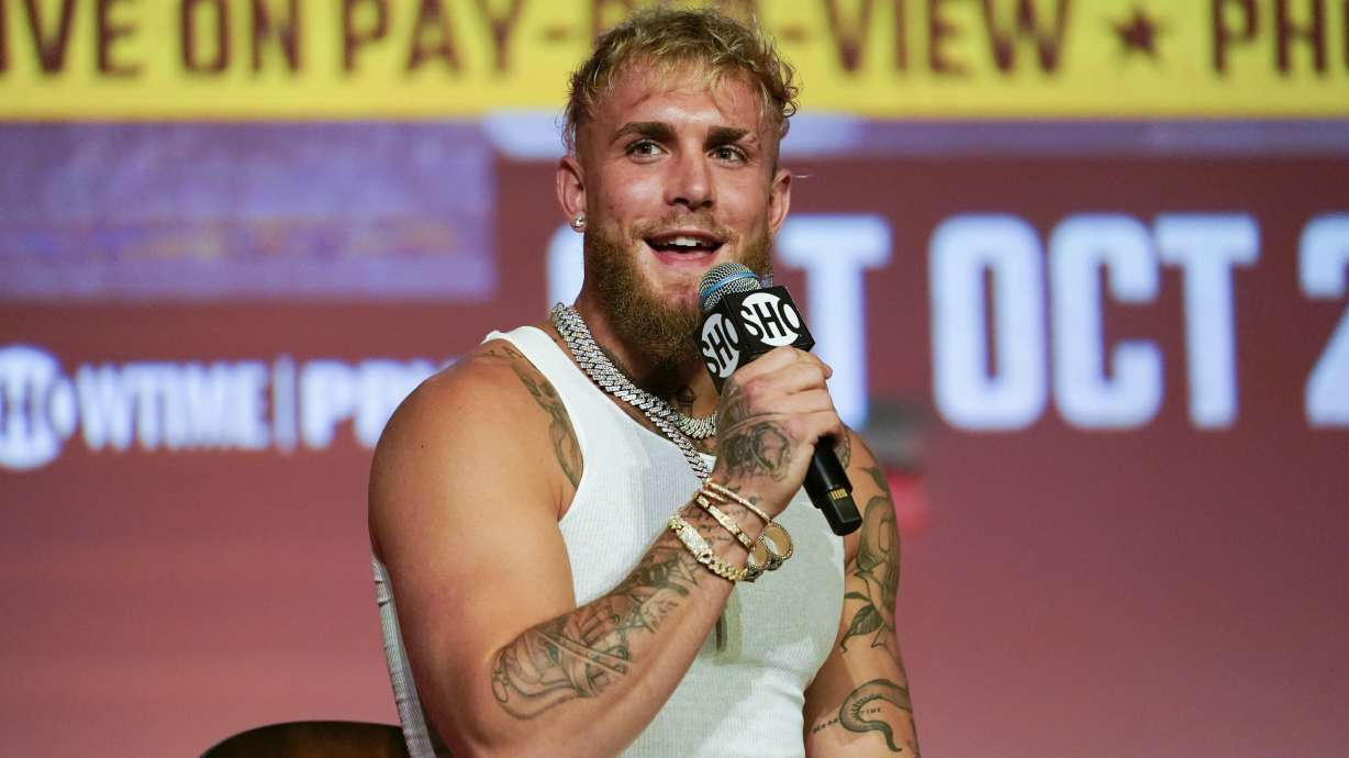FILE - Jake Paul speaks during a news conference Monday, Sept. 12, 2022, in Los Angeles. Jake Paul is teaming up with USA Boxing to put a spotlight on the nation’s top competitors at the 2024 Paris Olympics. The YouTube star and professional boxer will train with Olympic qualifiers and other fighters at USA Boxing’s home base in Colorado Springs next year, and he will amplify their stardom on his social media channels.