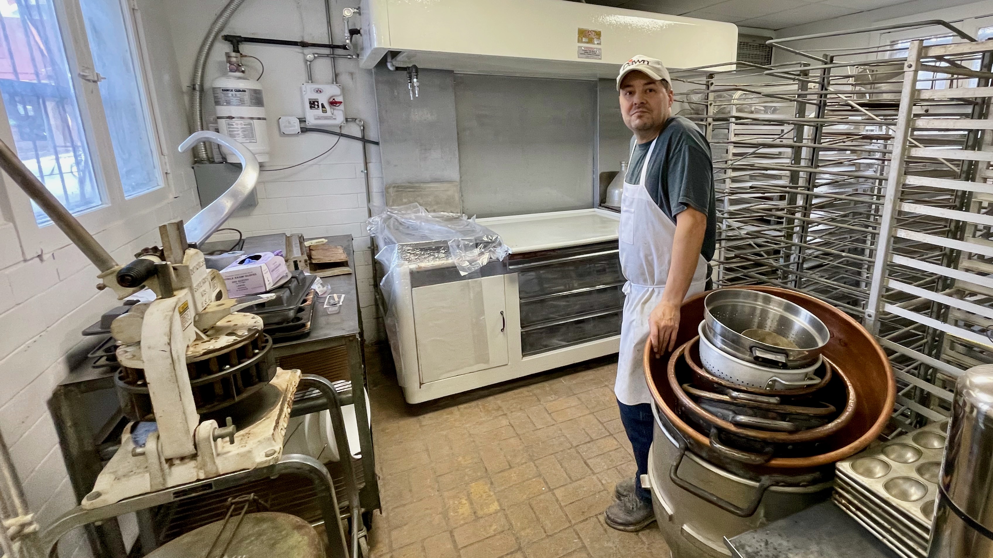 Lance DeRyke, operator at Topper Bakery in Ogden, on Monday. The popular locale was torched in a 2021 fire and DeRyke hopes to reopen next month as rebuilding nears completion.