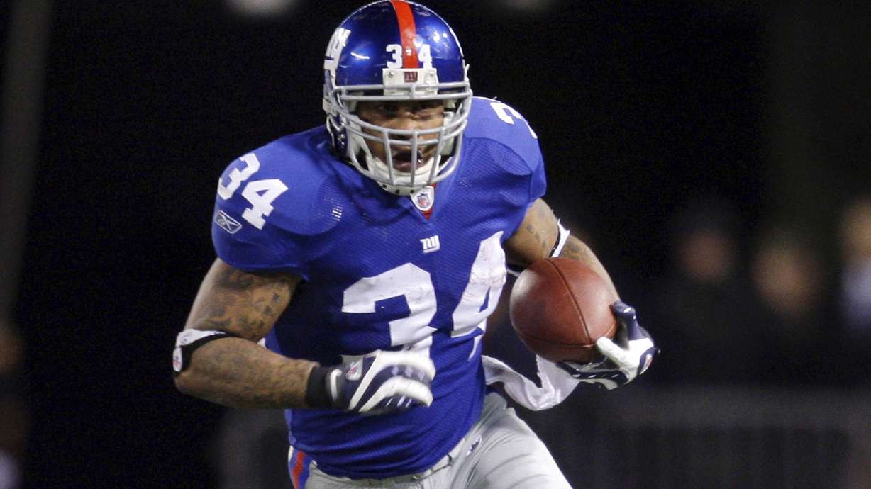 FILE - New York Giants running back Derrick Ward carries against the Carolina Panthers in an NFL football game in East Rutherford, N.J., Dec. 21, 2008. Ward has been arrested in Los Angeles on suspicion of robbery. Ward, 43, was arrested Monday, Dec. 18, 2023, in the North Hollywood area, police said. He was being held Tuesday on $250,000 bail, according to a Los Angeles County Sheriff's Department inmate search website.
