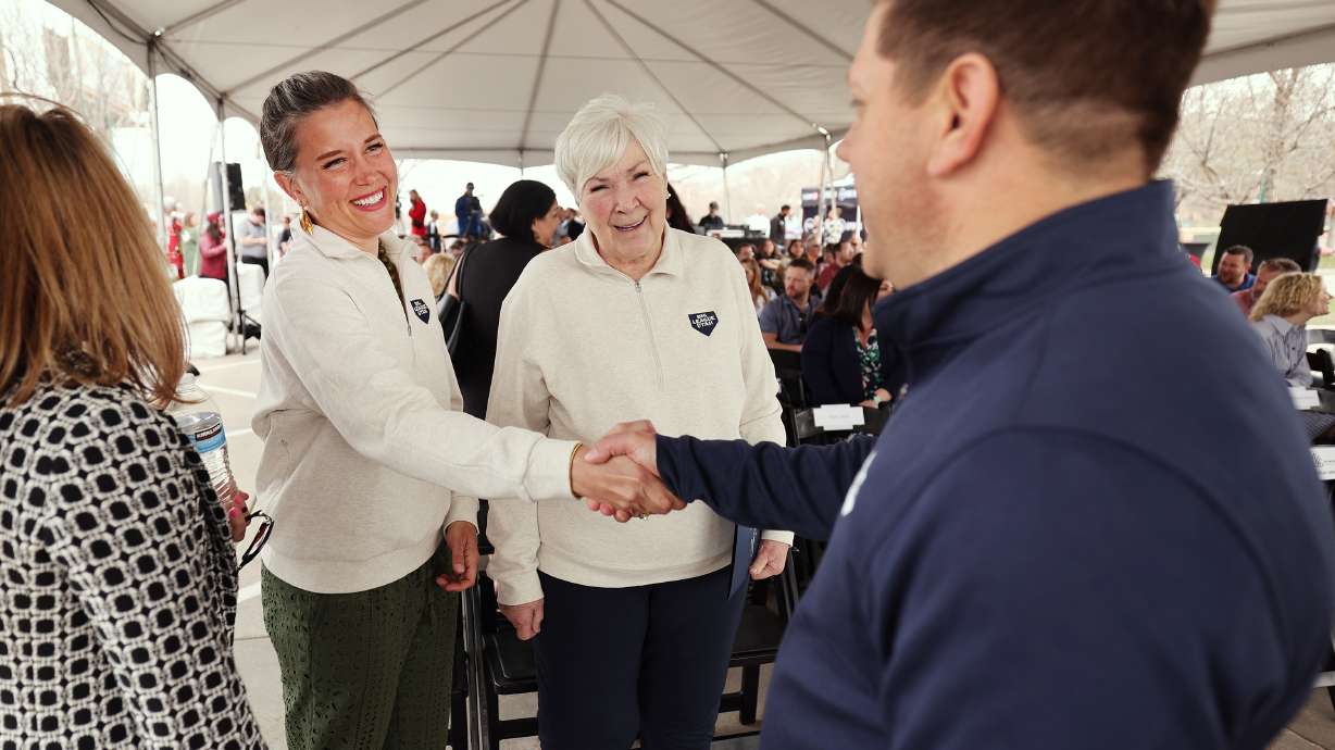 Salt Lake City Mayor Erin Mendenhall shakes hands with Steve Starks, chief executive officer of the Larry H. Miller Company, as they talk with Gail Miller at the groundbreaking of the Power District on the west side of Salt Lake City on April 12. Big League Utah, which wants to build a stadium on the site, announced two new advisory boards Wednesday that seek to highlight the collaboration in their efforts.