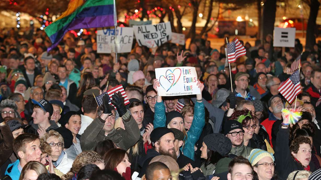 People gather at the Salt Lake City-County Building on Dec. 23, 2013, to celebrate a federal judge's decision declining to stay his ruling that legalized same-sex marriage in Utah. Ten years later, Utah Gov. Spencer Cox says there's been a "major shift."