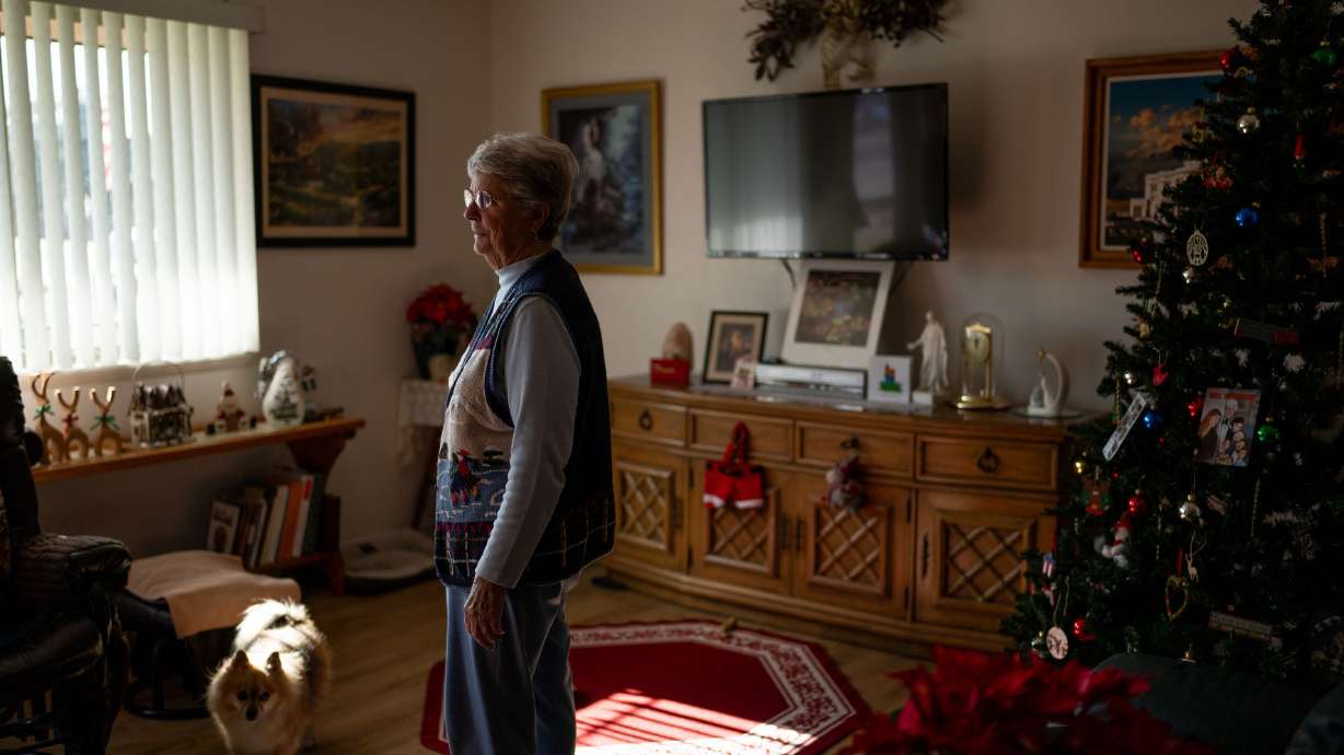 Alicia Bultez stands at her home in Santaquin on Dec. 13. The 81-year-old woman was the victim of a romance scam.