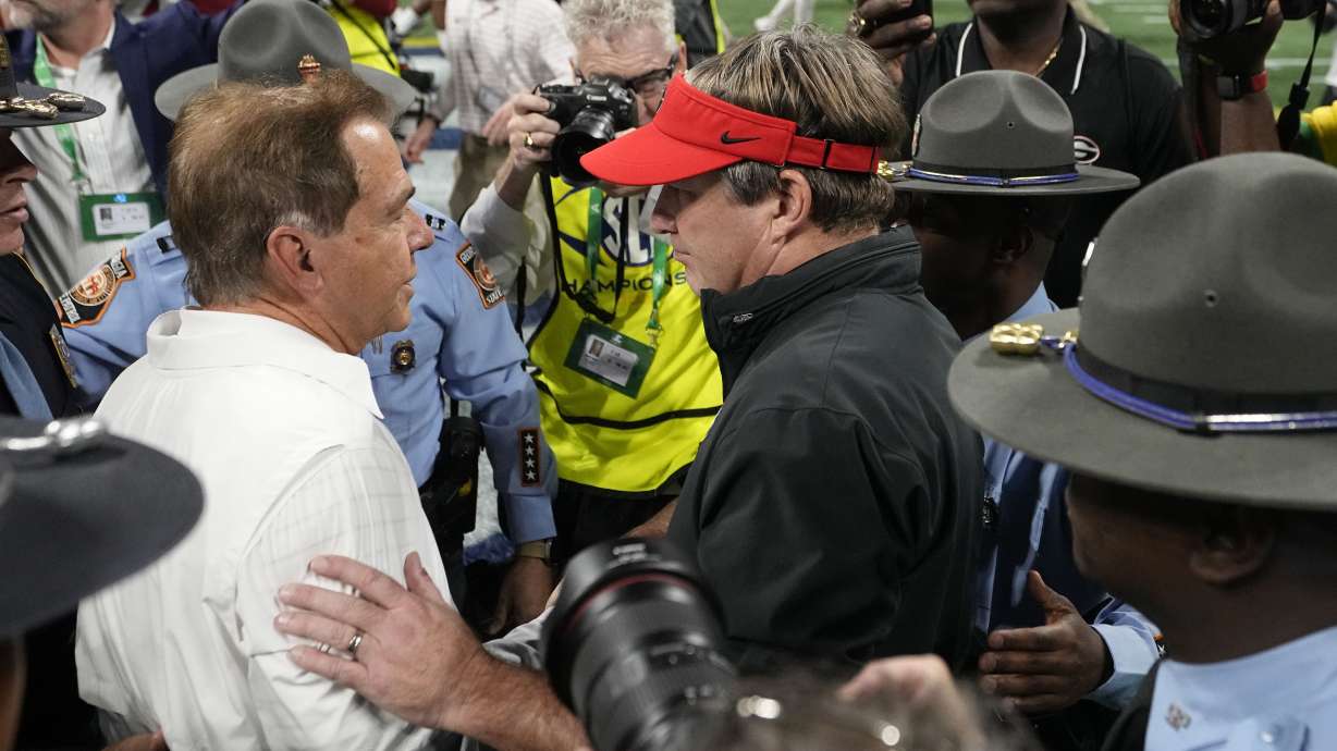 Georgia head coach Kirby Smart, and Alabama head coach Nick Saban meet after the Southeastern Conference championship NCAA college football game in Atlanta, Saturday, Dec. 2, 2023.