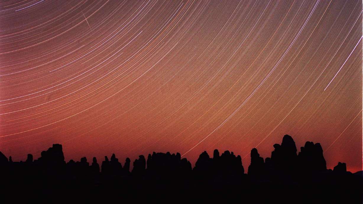 Star streaks are seen over the Doll House in Canyonlands National Park in this approximately six-hour time exposure taken on April 25, 2016. Clouds may complicate some night sky viewing in parts of Utah for winter solstice Thursday.