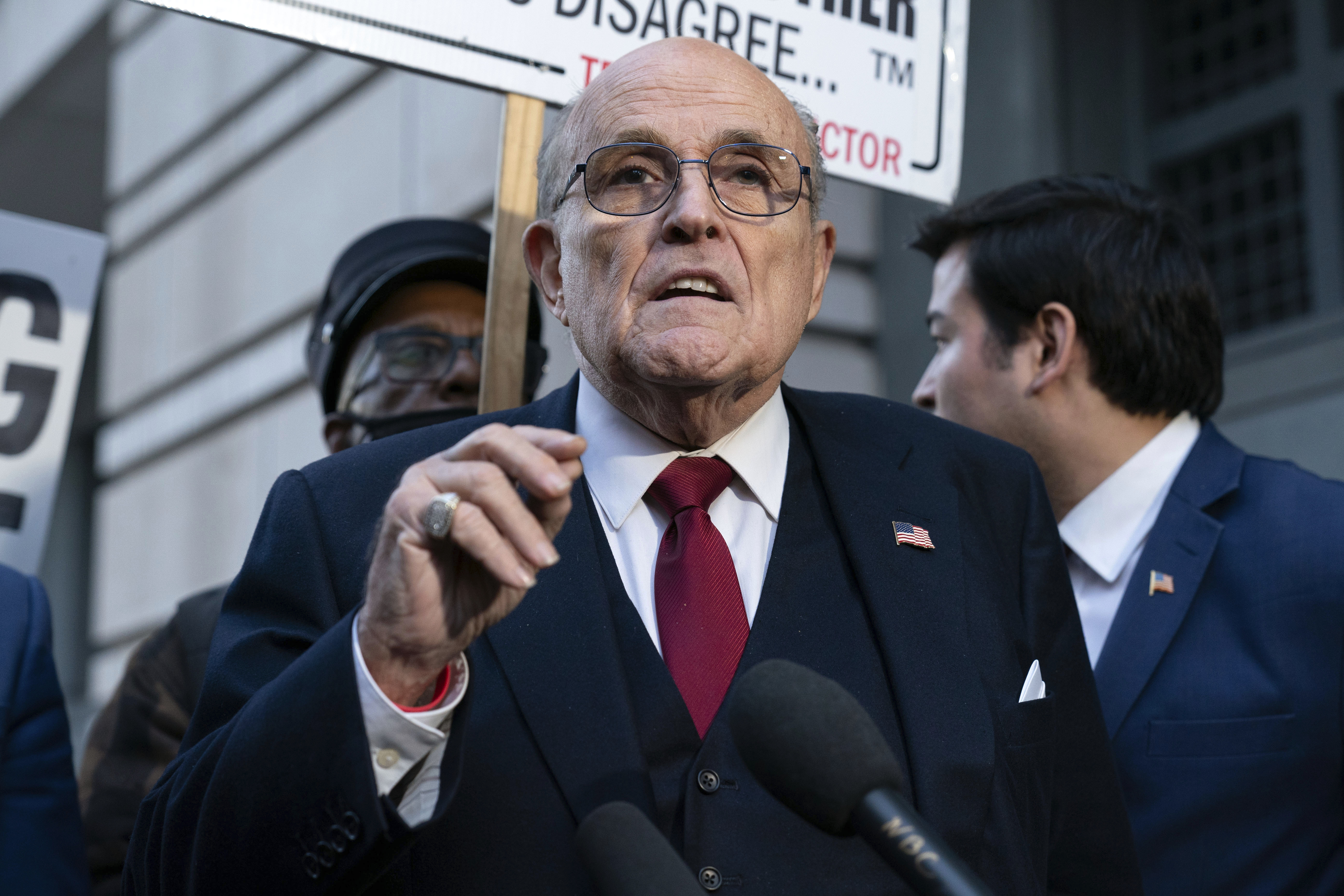 Former Mayor of New York Rudy Giuliani speaks during a news conference outside the federal courthouse in Washington, Friday. Giuliani has filed for bankruptcy, days after being ordered to pay $148 million in a defamation lawsuit.