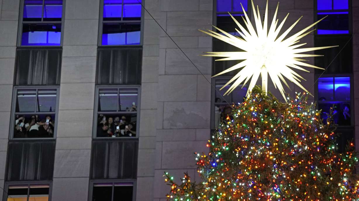 The Rockefeller Center Christmas tree is lit on Wednesday, Nov. 29, in New York.