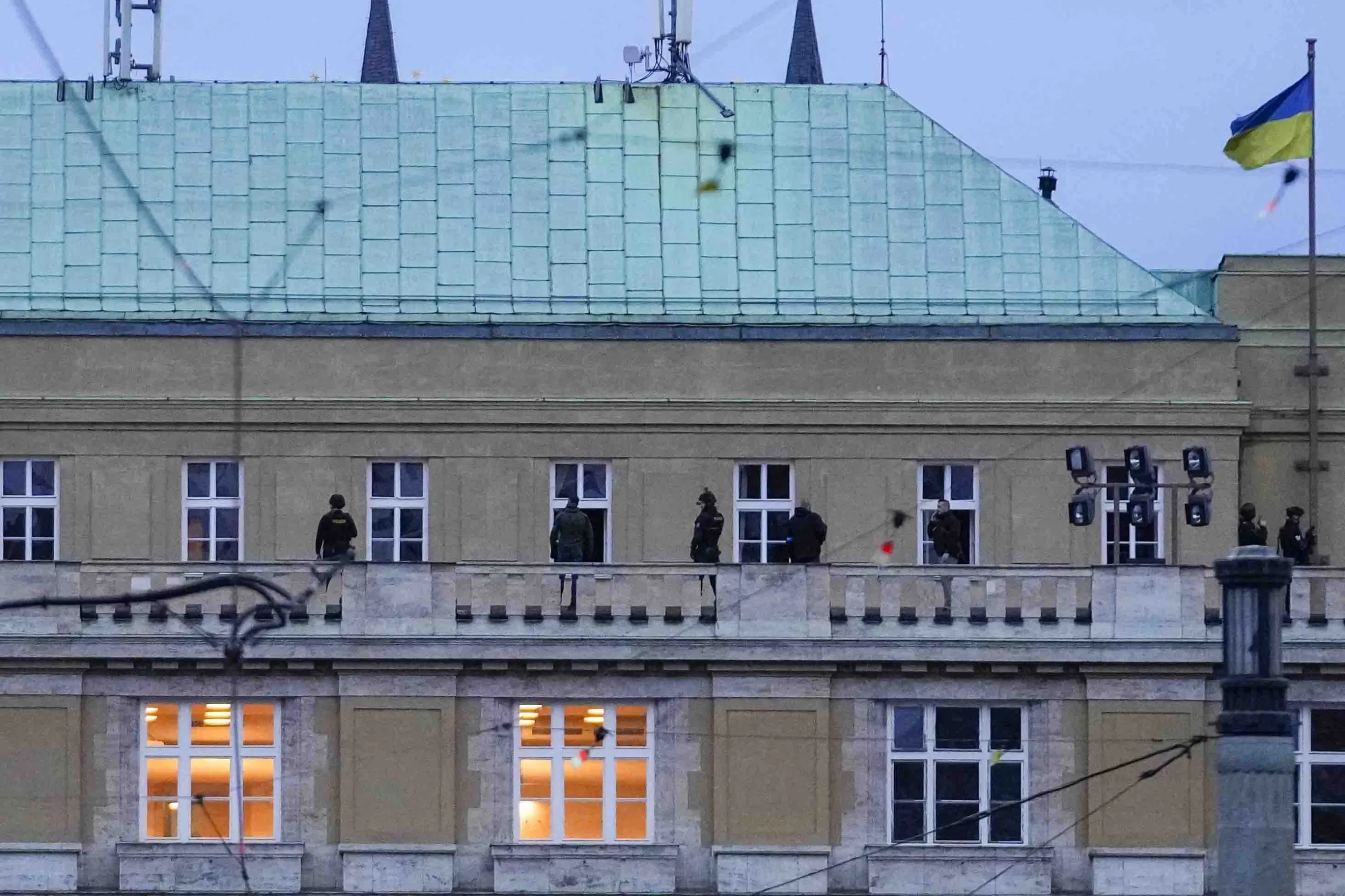 Police officers stand on the balcony of Philosophical Faculty of Charles University in downtown Prague, Czech Republic, Thursday.