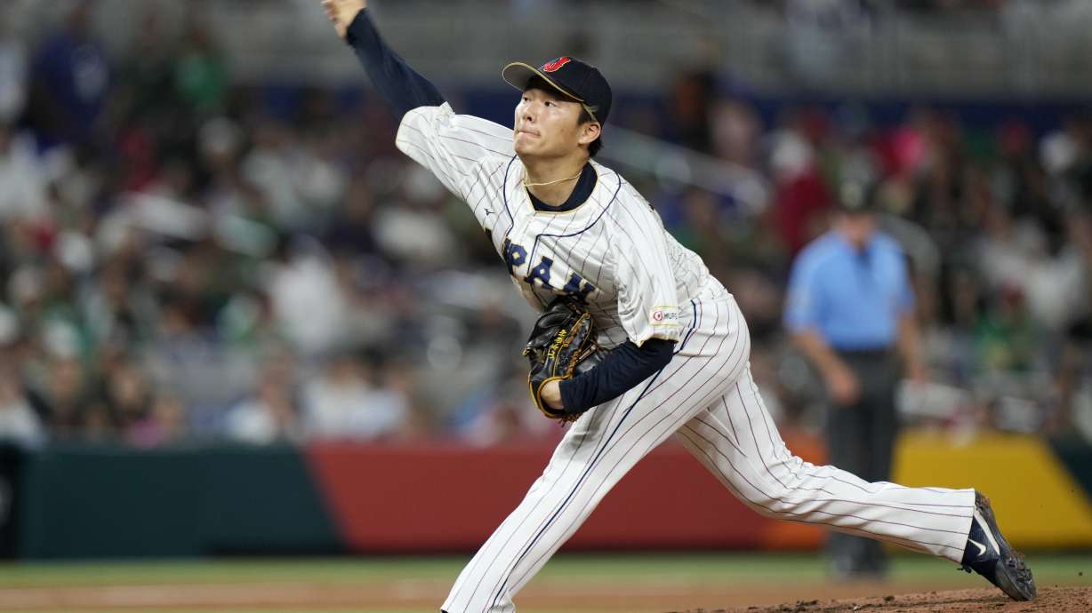 FILE - Japan's Yoshinobu Yamamoto delivers a pitch during the fifth inning of a World Baseball Classic game against Mexico on March 20, 2023, in Miami. Yamamoto already has a New York Yankees pinstripes with No. 18, the numeral prized by manager Japanese pitchers. “I gave him that jersey. It's his if he wants to keep it,” Yankees manager Aaron Boone said Thursday, Dec. 21, 2023.