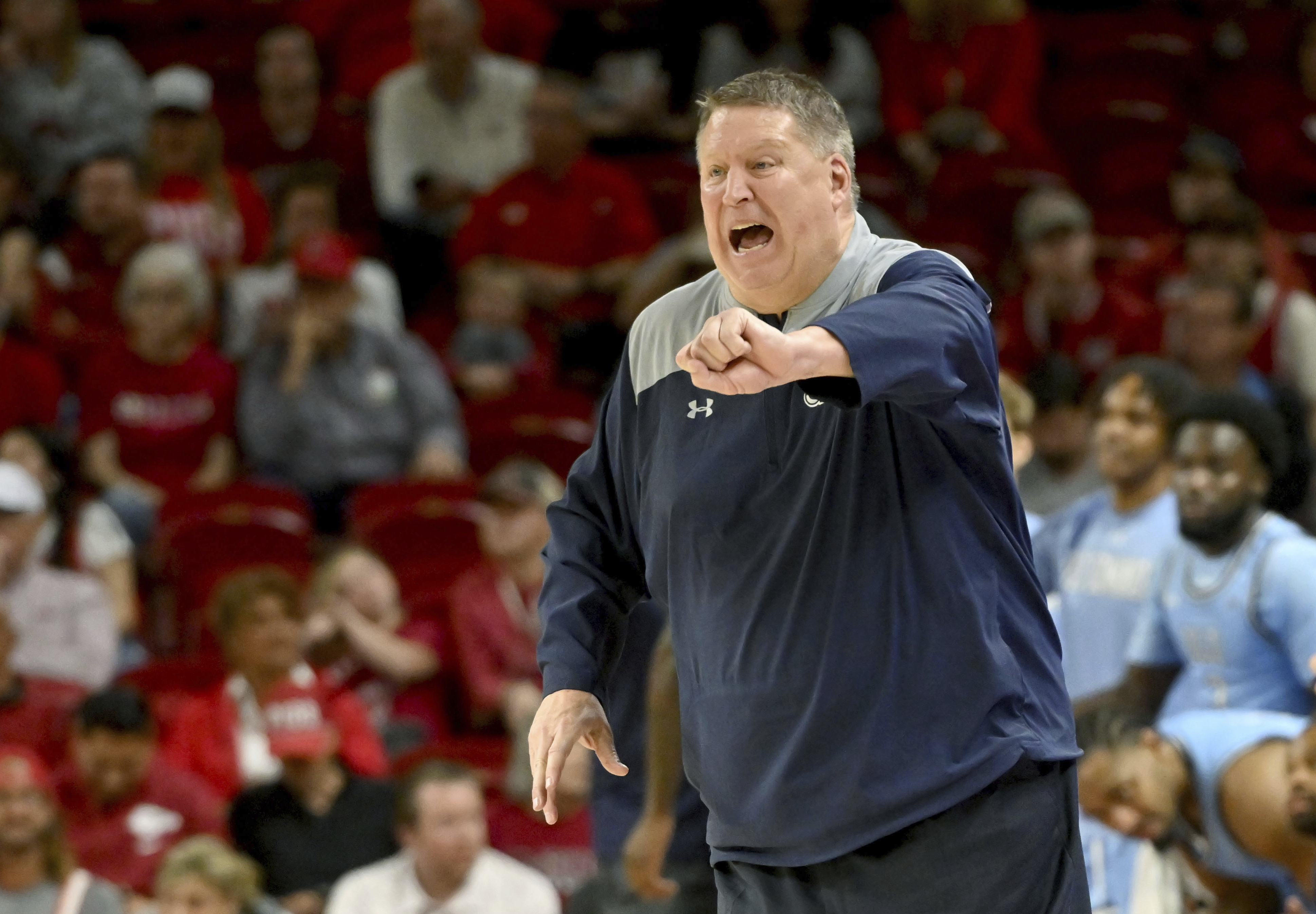 FILE - Old Dominion coach Jeff Jones reacts after a call during the second half of the team's NCAA college basketball game against Arkansas, Nov. 13, 2023, in Fayetteville, Ark. Jones has been hospitalized in Honolulu after suffering a heart attack Wednesday, Dec. 20, the school said. “He is resting comfortably and expecting a full recovery,” Old Dominion said in a statement Thursday. The 63-year-old Jones is being held for observation and will not be available to coach in the Diamond Head Classic. 