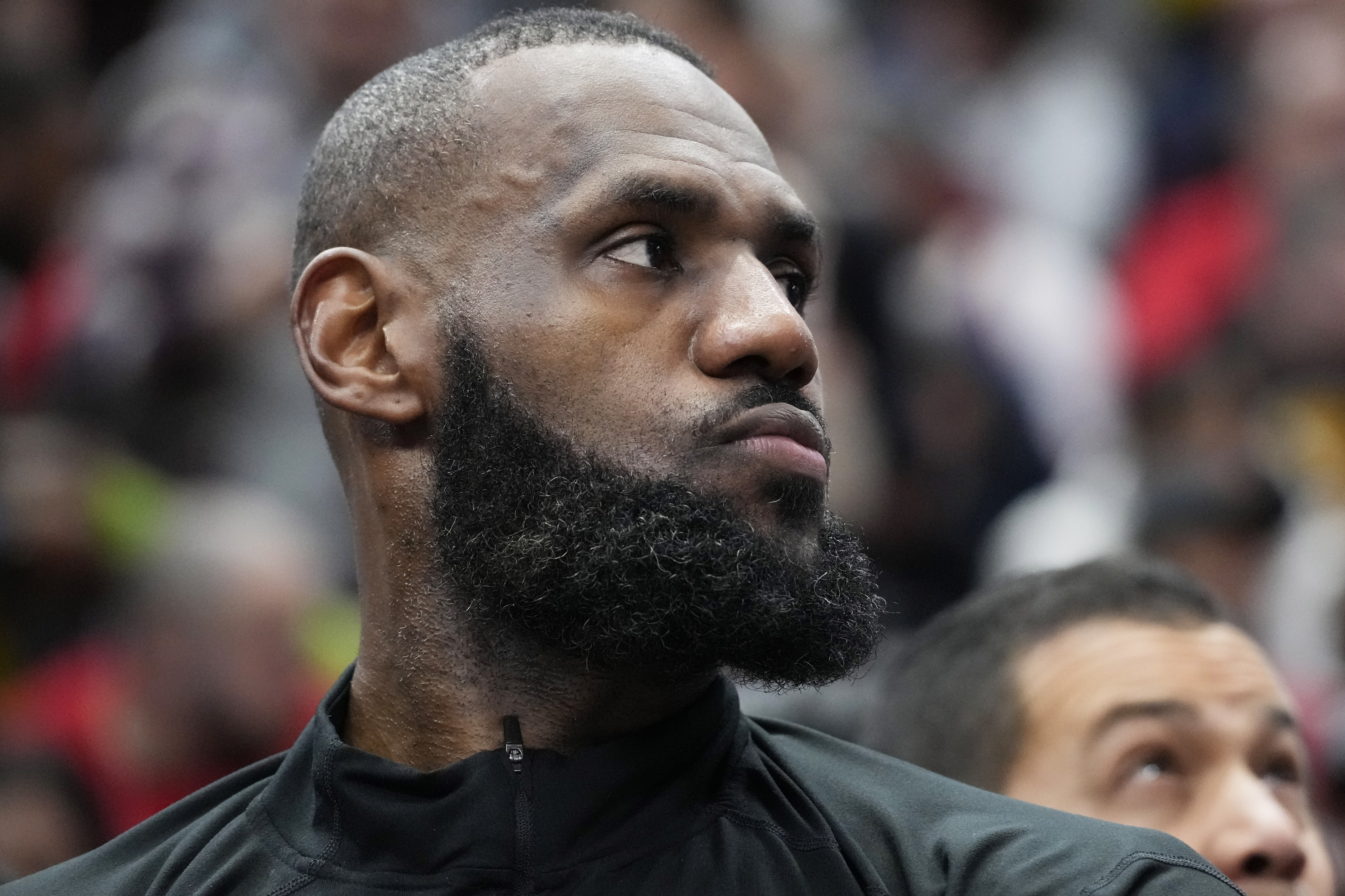 Los Angeles Lakers forward LeBron James reacts as he watches teammates during the second half of an NBA basketball game against the Chicago Bulls in Chicago, Wednesday, Dec. 20, 2023. The Bulls won 124-108. 