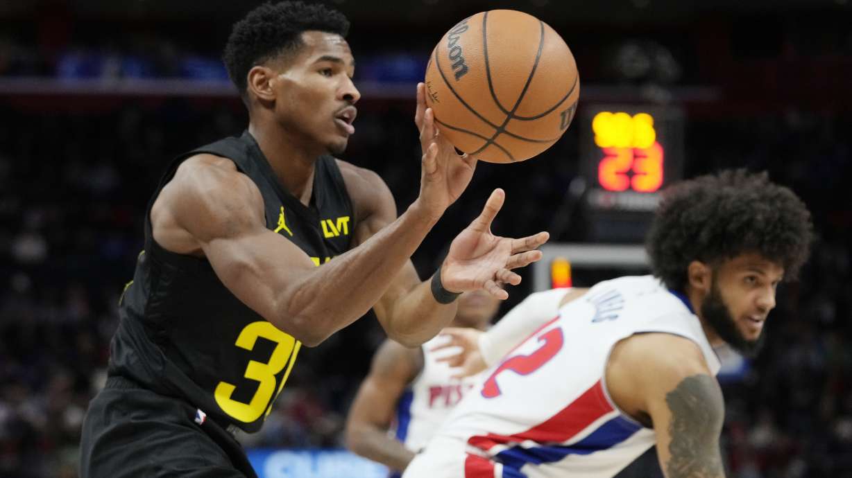 Utah Jazz guard Ochai Agbaji grabs a rebound during the first half of an NBA basketball game against the Detroit Pistons, Thursday, Dec. 21, 2023, in Detroit.