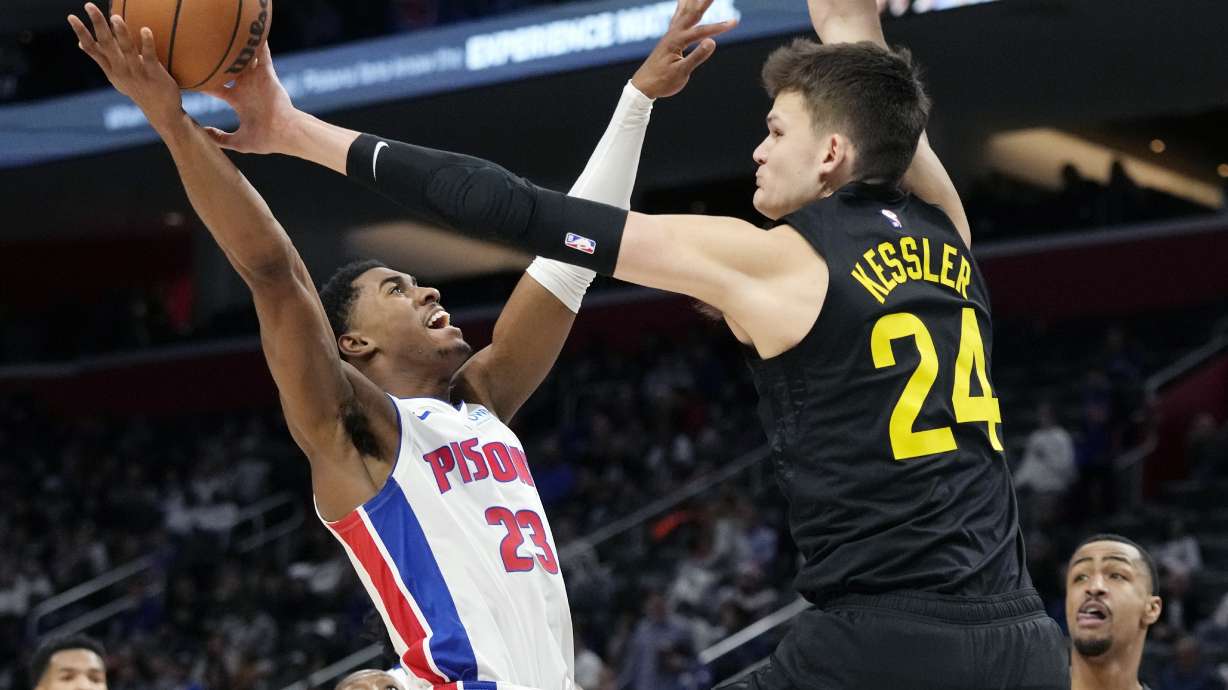 Utah Jazz center Walker Kessler (24) blocks a shot by Detroit Pistons guard Jaden Ivey (23) during the first half of an NBA basketball game, Thursday, Dec. 21, 2023, in Detroit.