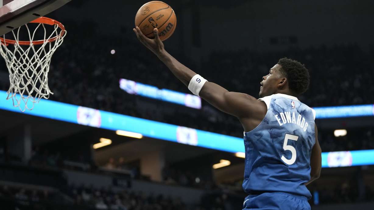 Minnesota Timberwolves guard Anthony Edwards (5) goes up to shoot during the first half of an NBA basketball game against the Los Angeles Lakers, Thursday, Dec. 21, 2023, in Minneapolis.