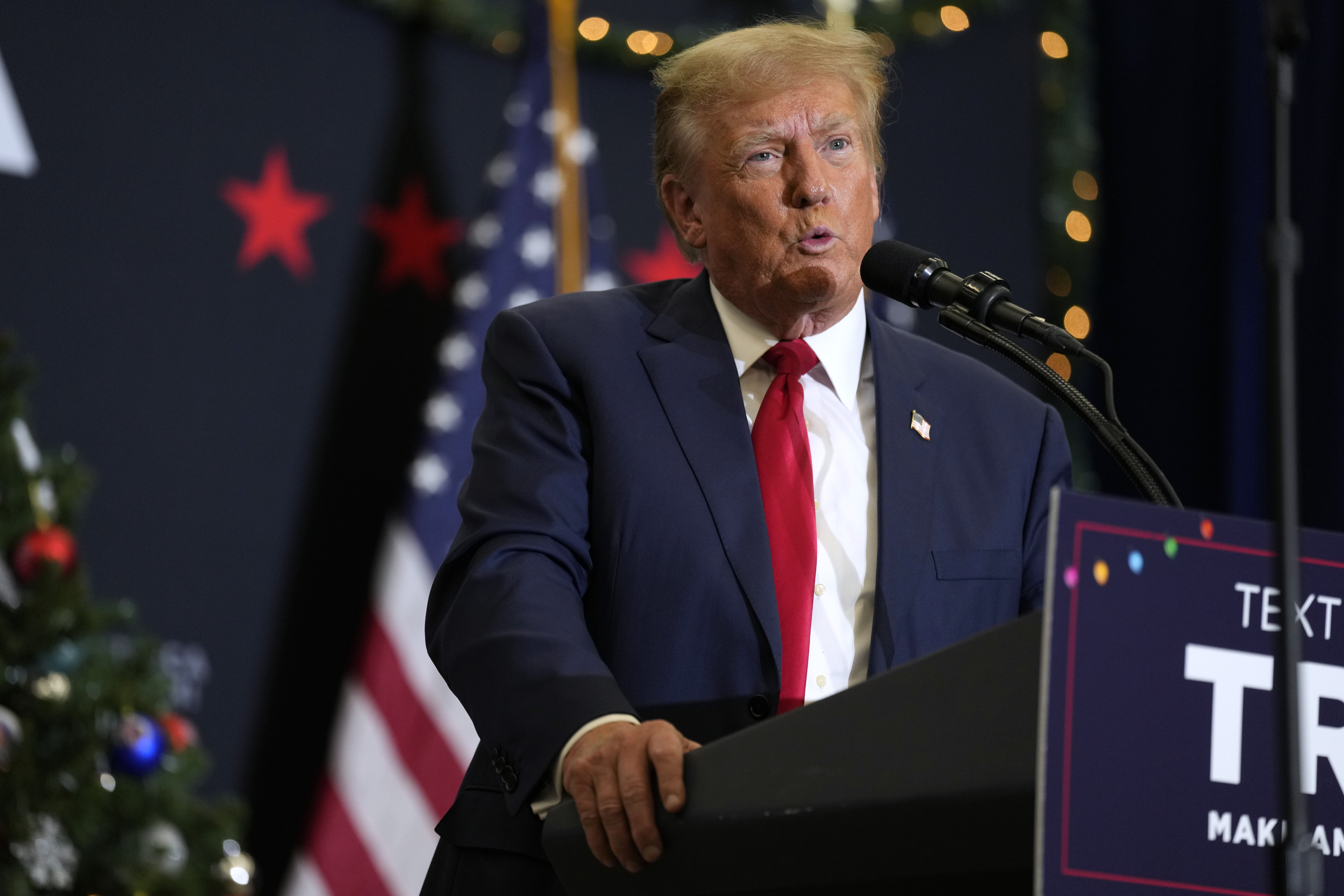 Former President Donald Trump speaks during a commit to caucus rally, Tuesday, in Waterloo, Iowa. A new report says Donald pressured two election officials not to certify 2020 vote totals in a key Michigan county.