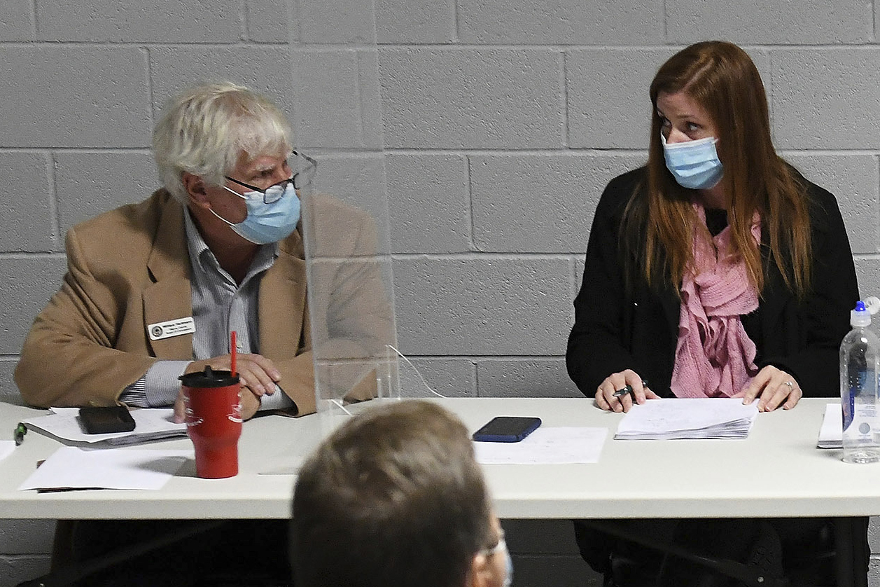 Wayne County Board of Canvassers Republican member William Hartmann, left, and Republican chairperson Monica Palmer attend a board meeting, which addressed the Nov. 3, election, in Detroit on Nov. 17, 2020.