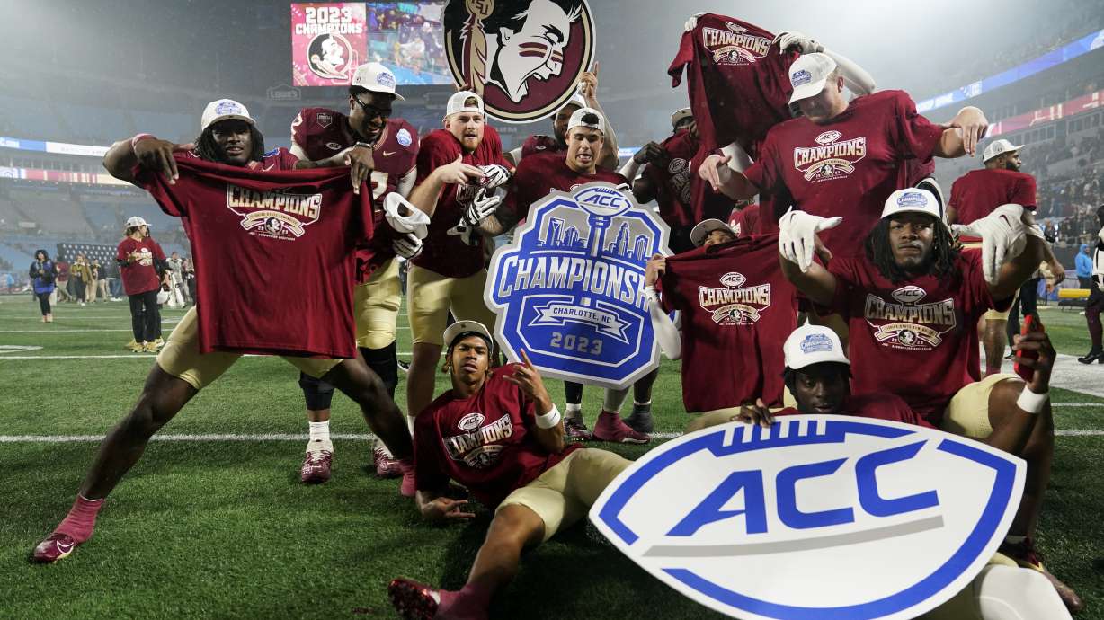 FILE - Florida State players pose after defeating Louisville in the Atlantic Coast Conference championship NCAA college football game Saturday, Dec. 2, 2023, in Charlotte, N.C. Florida State announced it will hold a Board of Trustees meeting on Friday, Dec. 22, and a person with knowledge of the situation told The Associated Press the future of the athletic department and its affiliation with the Atlantic Coast Conference will be discussed.