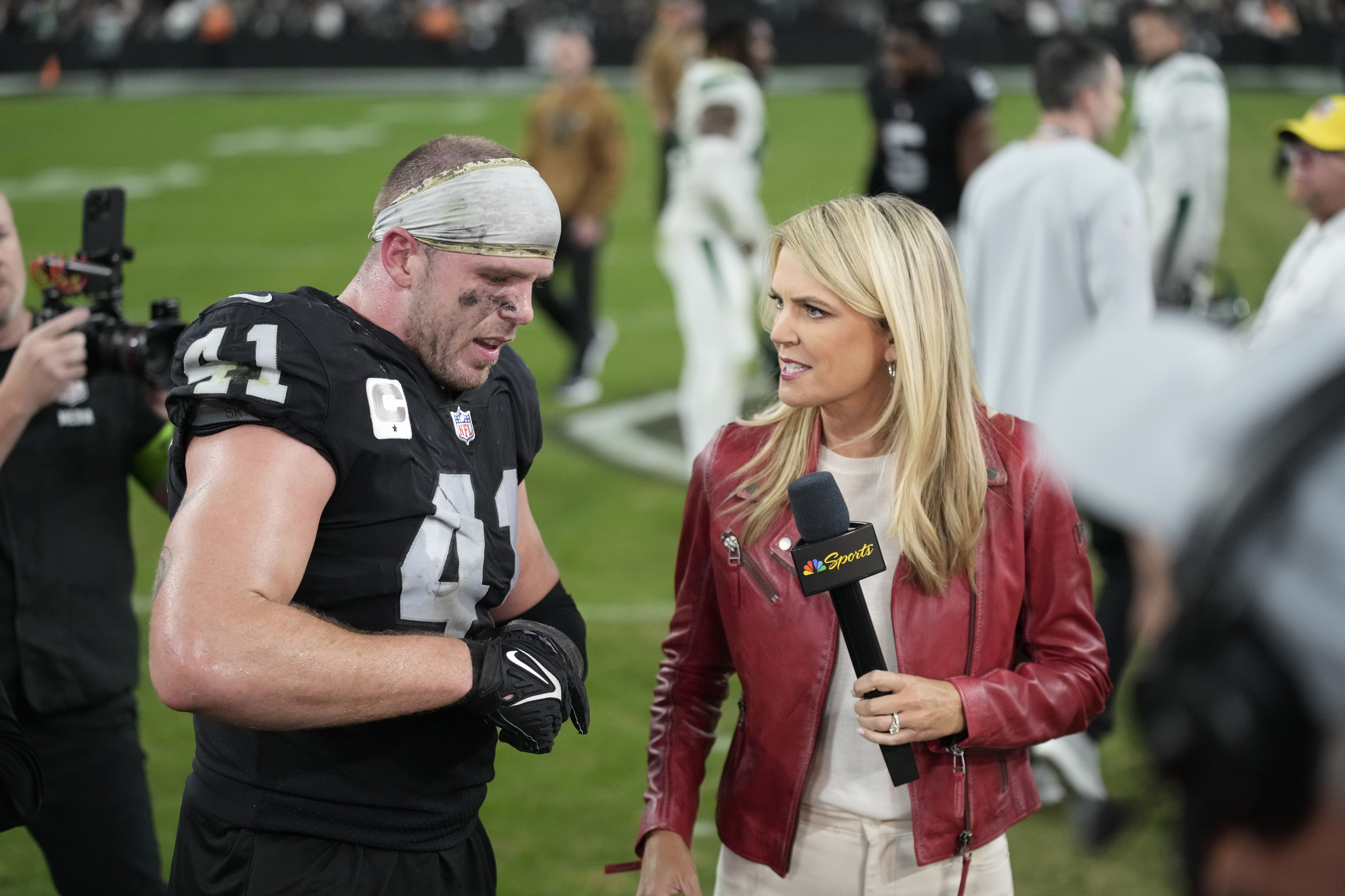 FILE - Las Vegas Raiders linebacker Robert Spillane is interviewed by NBC sports sideline reporter Melissa Stark following an NFL football game Sunday, Nov. 12, 2023, in Las Vegas. Stark has reported from sidelines in 39 stadiums on three networks and in two countries. The veteran NFL reporter adds another numeric milestone during Saturday night, Dec. 23, 2023, game between the Buffalo Bills and Los Angeles Chargers when she covers her 100th regular-season game.