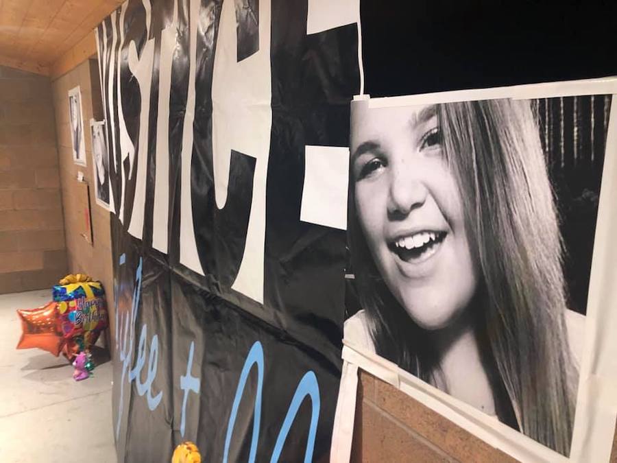 A banner with Tylee Ryan’s photo on display at a vigil in June 2020. A judge has ordered Tylee's remains to be turned over to her family members.