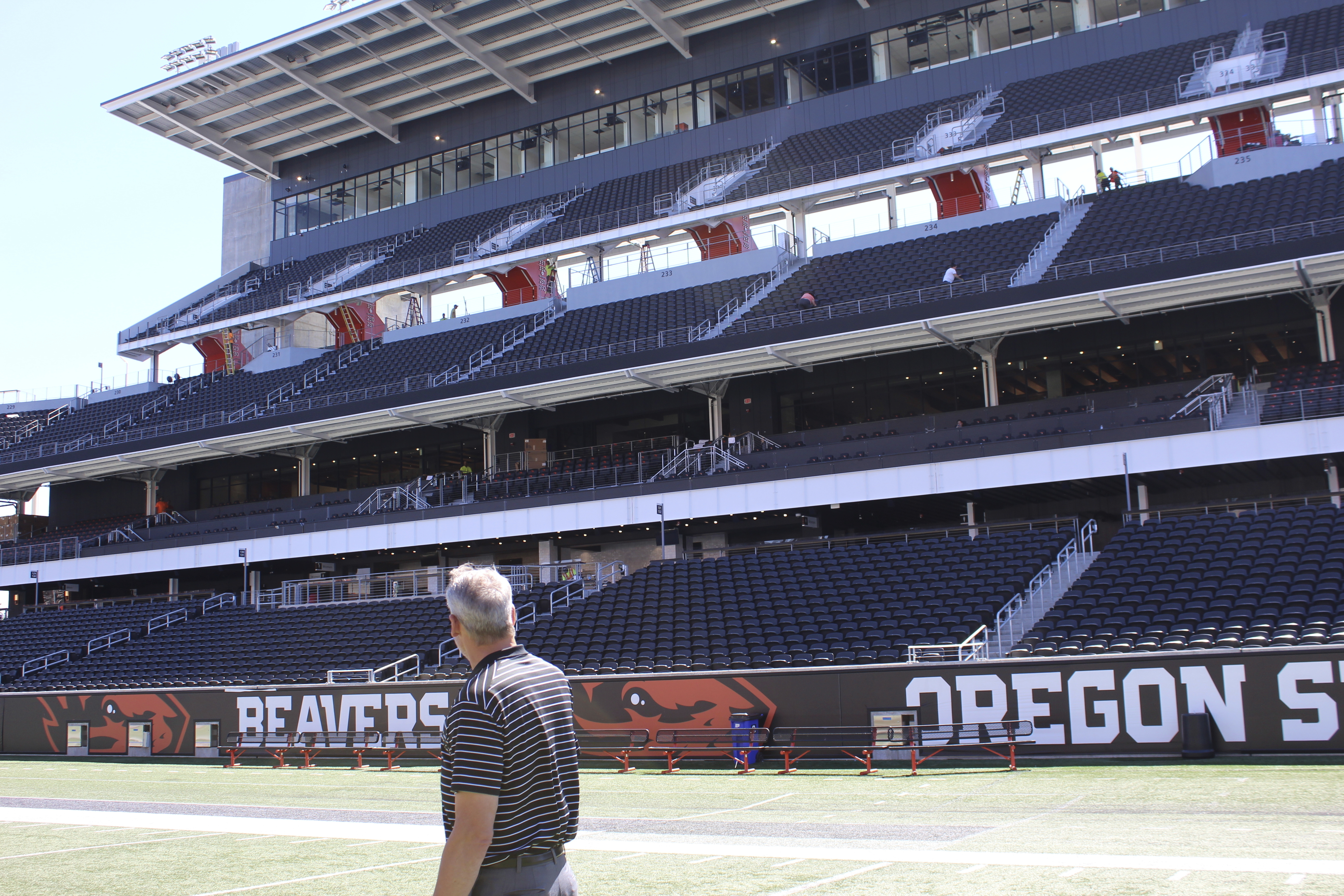 Oregon State athletic director Scott Barnes looks at the renovated side of Reser Stadium on Tuesday, Aug. 8, 2023, in Corvallis, Ore. The Pac-12 was ripped apart and redistributed by its competitors, regardless of geography. The stunning demolition, set in motion a year earlier, was accelerated when the Pac-12 couldn’t secure a media rights deal to match its competitors.