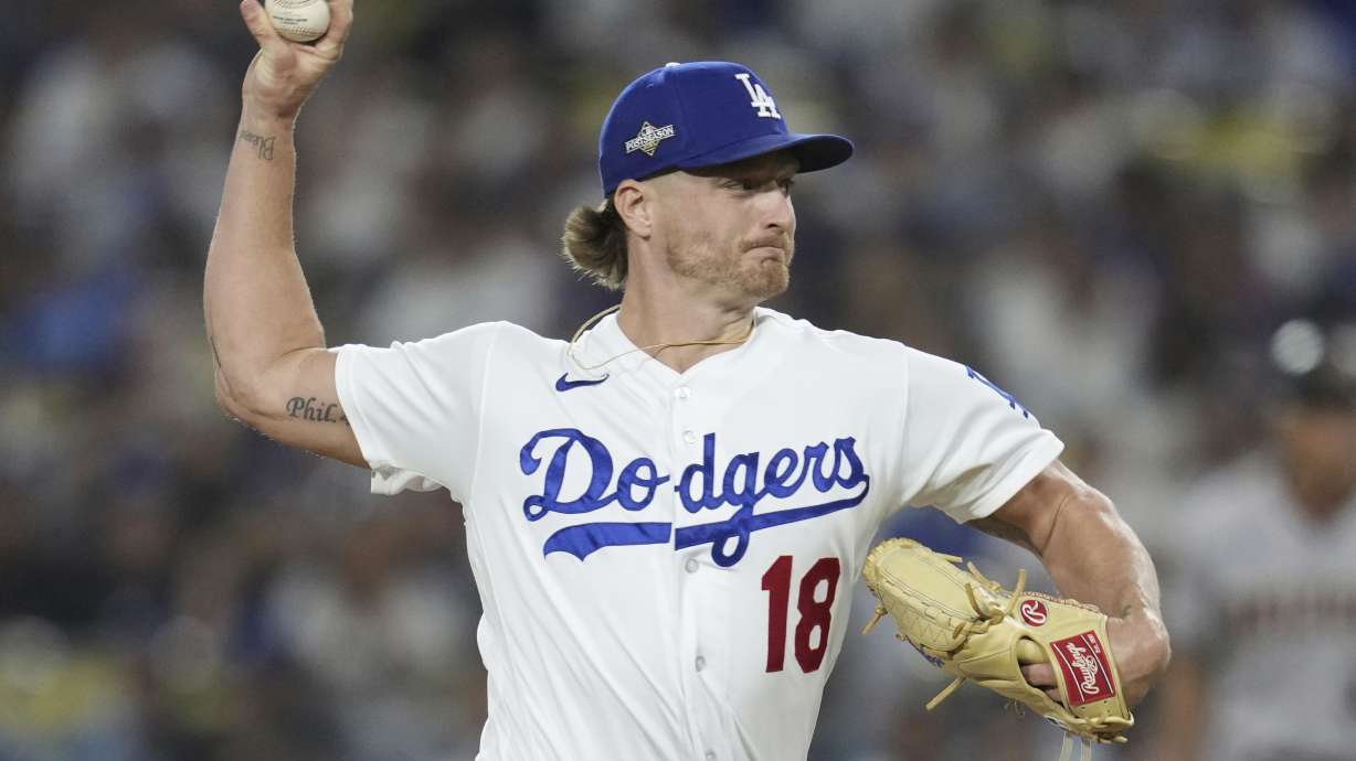 FILE - Los Angeles Dodgers relief pitcher Shelby Miller delivers during the third inning in Game 1 of a baseball NL Division Series against the Arizona Diamondbacks, Oct. 7, 2023, in Los Angeles. Miller agreed Friday, Dec. 22, to a $3.25 million, one-year contract with the Detroit Tigers, a deal including a 2025 team option and performance bonuses that could be worth up to $11 million over two seasons if he closes regularly.