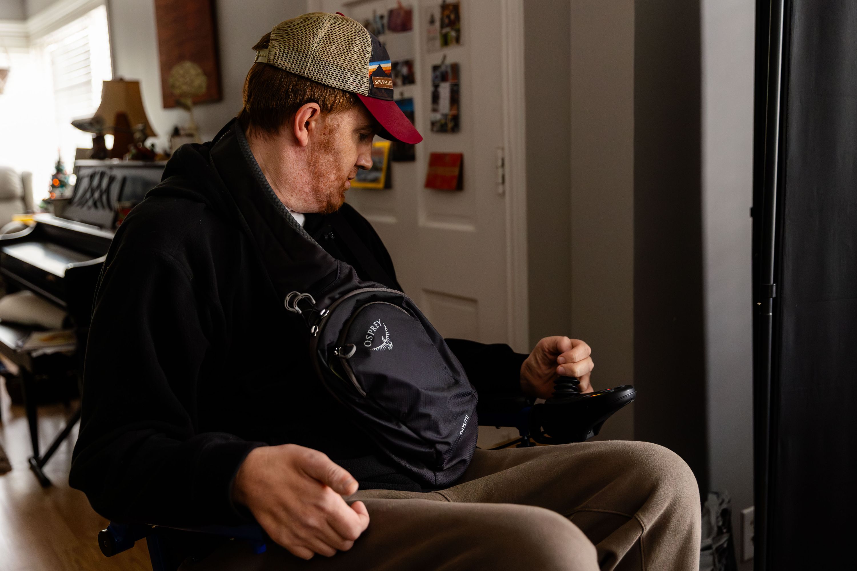 Sean Cunningham backs up in his wheelchair as he prepares to leave for a doctor’s appointment at his home in Salt Lake City on Dec. 20.