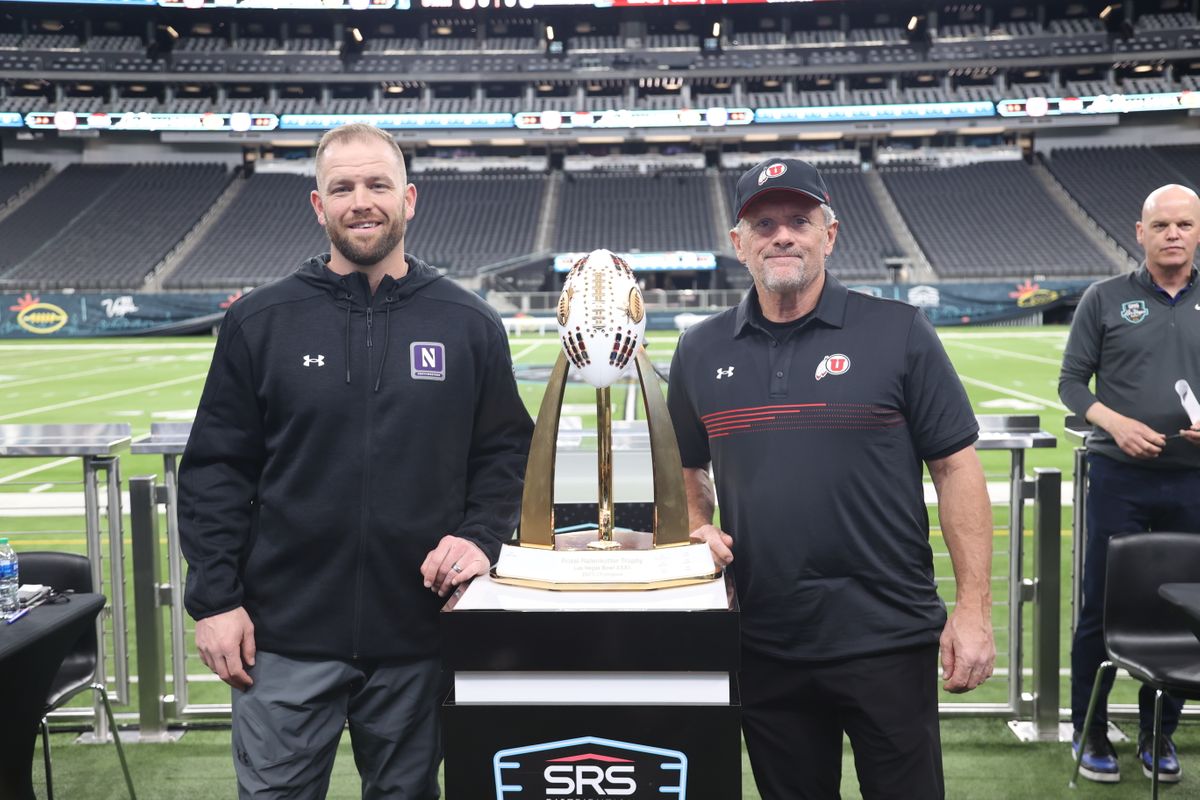 David Braun of the Northwestern University Wildcats and Kyle Whittingham of the University of Utah Utes at the Kickoff Media Conference prior to the 2023 Las Vegas Bowl.